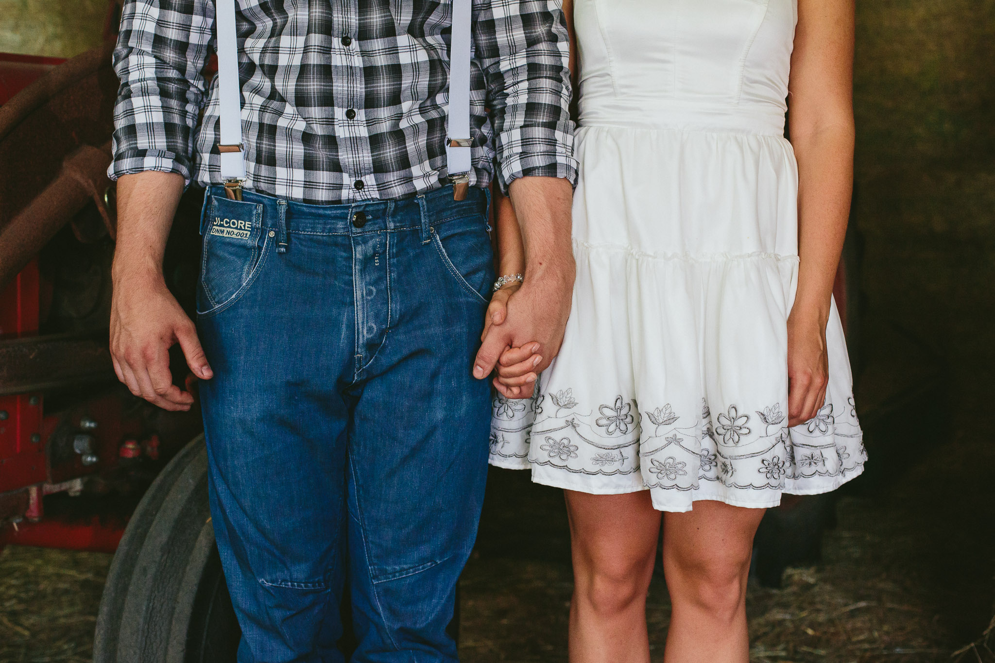 holding hands in a barn