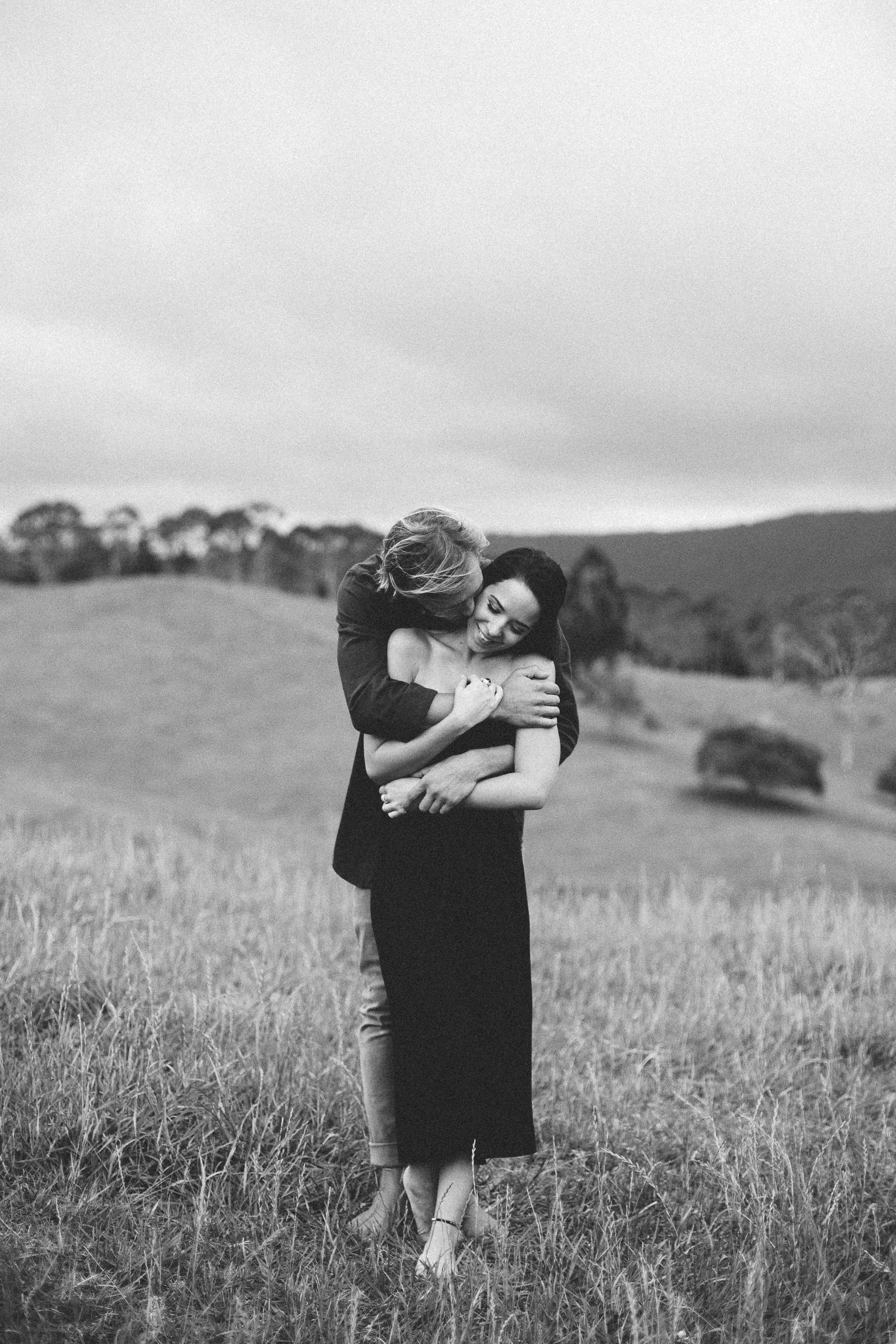 him hugging her laughing