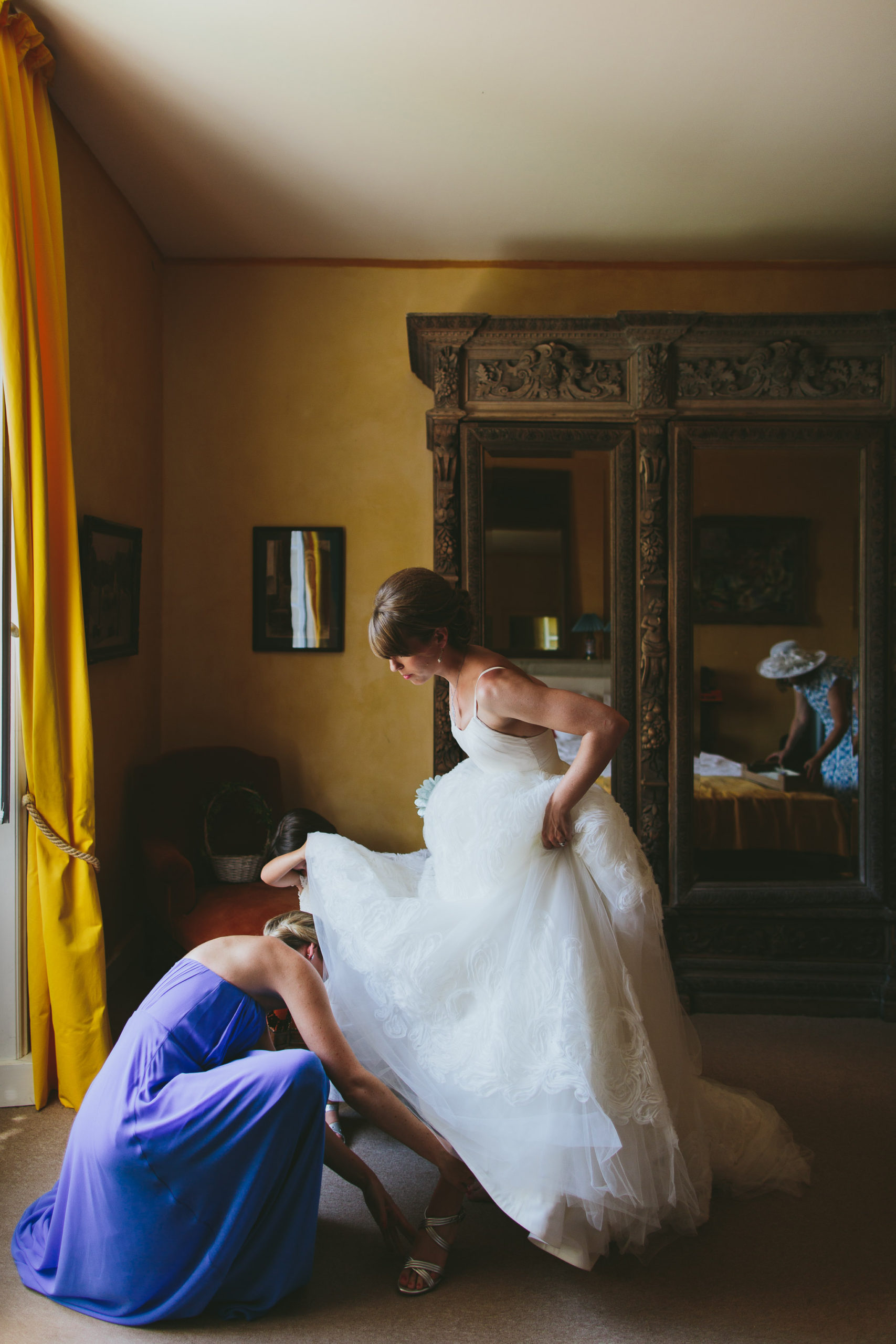 French professional wedding photographer bride getting dress