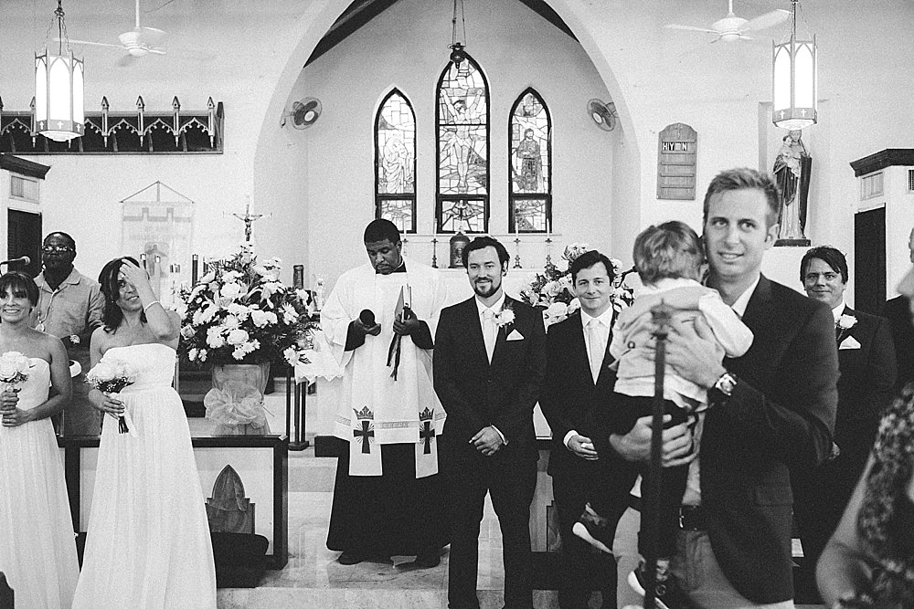 Bahamian groom waiting for bride end of aisle