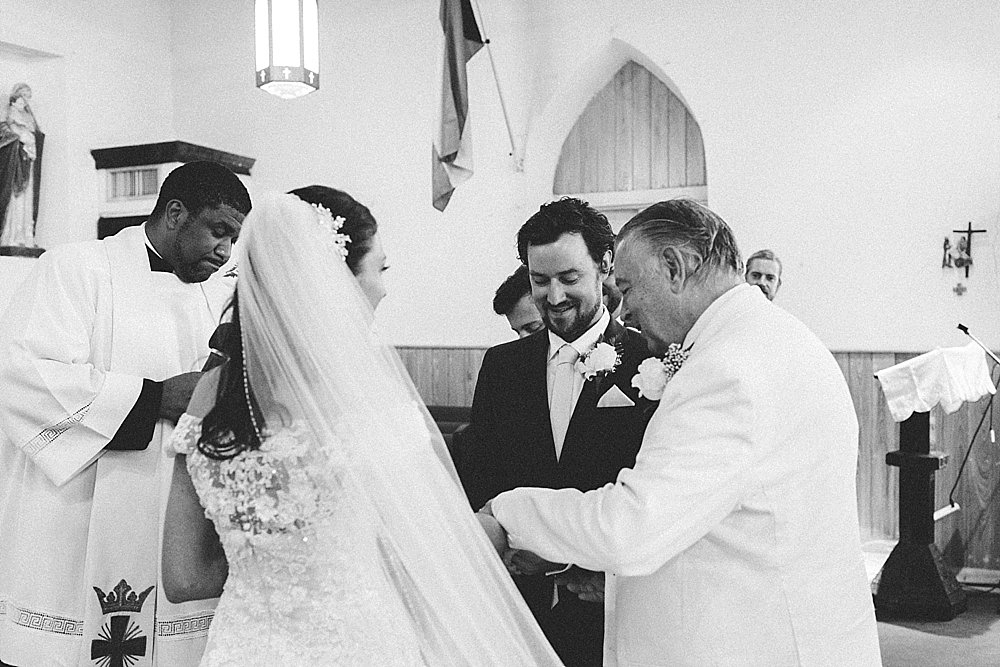 Bahamian wedding farther hand daughte to groom