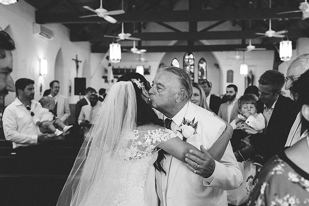 Bahamian wedding farther kiss his daughter in church