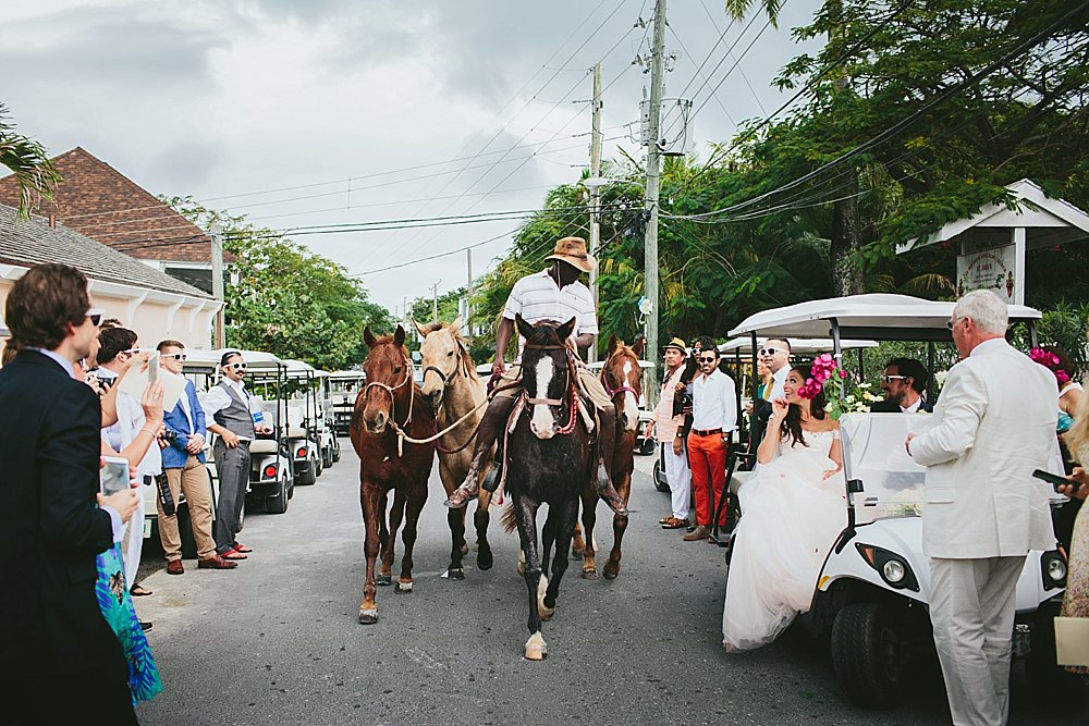 Bahamian wedding church exit horses trotting by