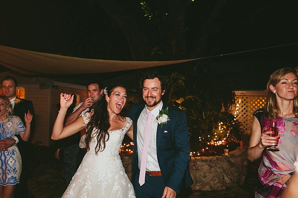 Bahamian wedding party bride and groom having a good time