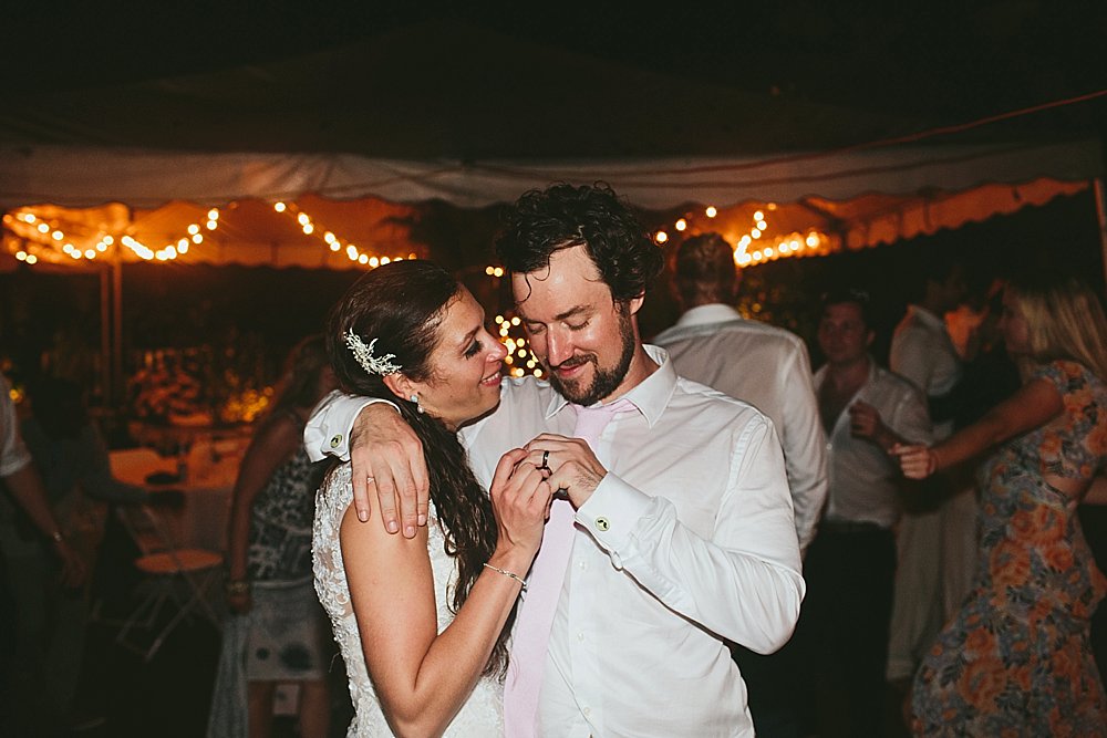 Bahamian wedding party looking at wedding rings