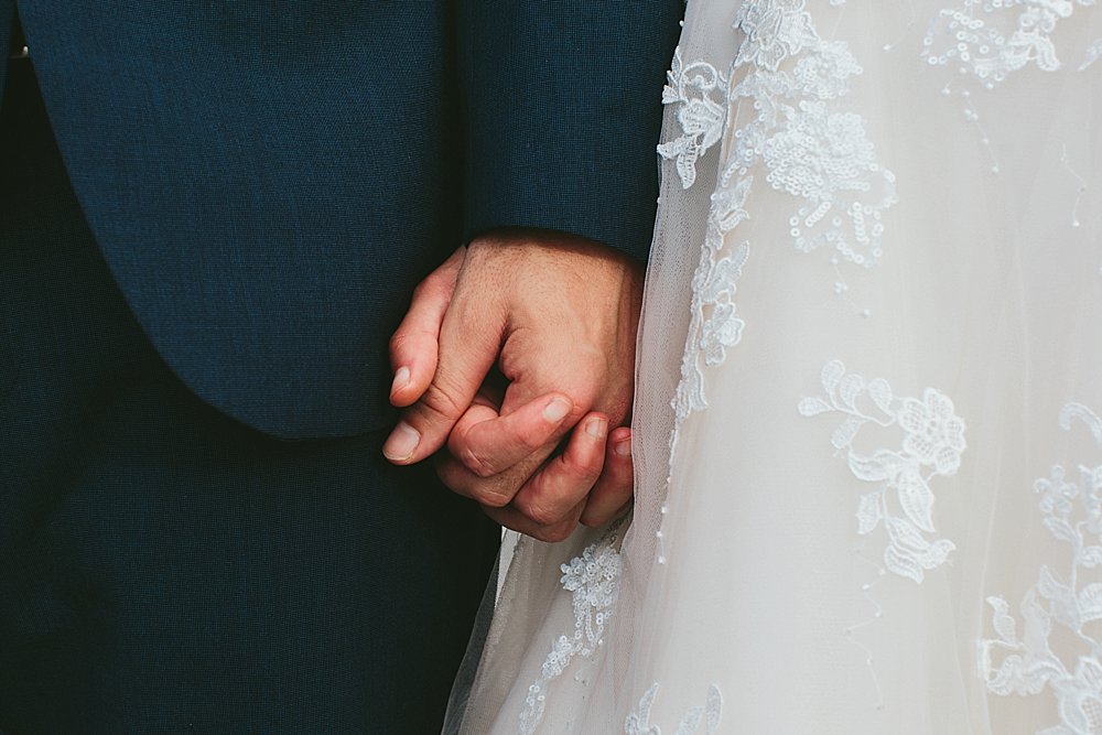 Bahamian wedding bride and groom holding hands