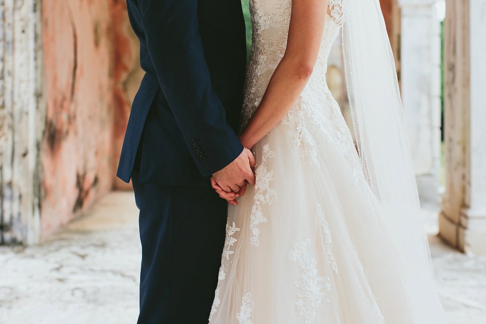 Bahamian wedding bride and groom close together holding hands