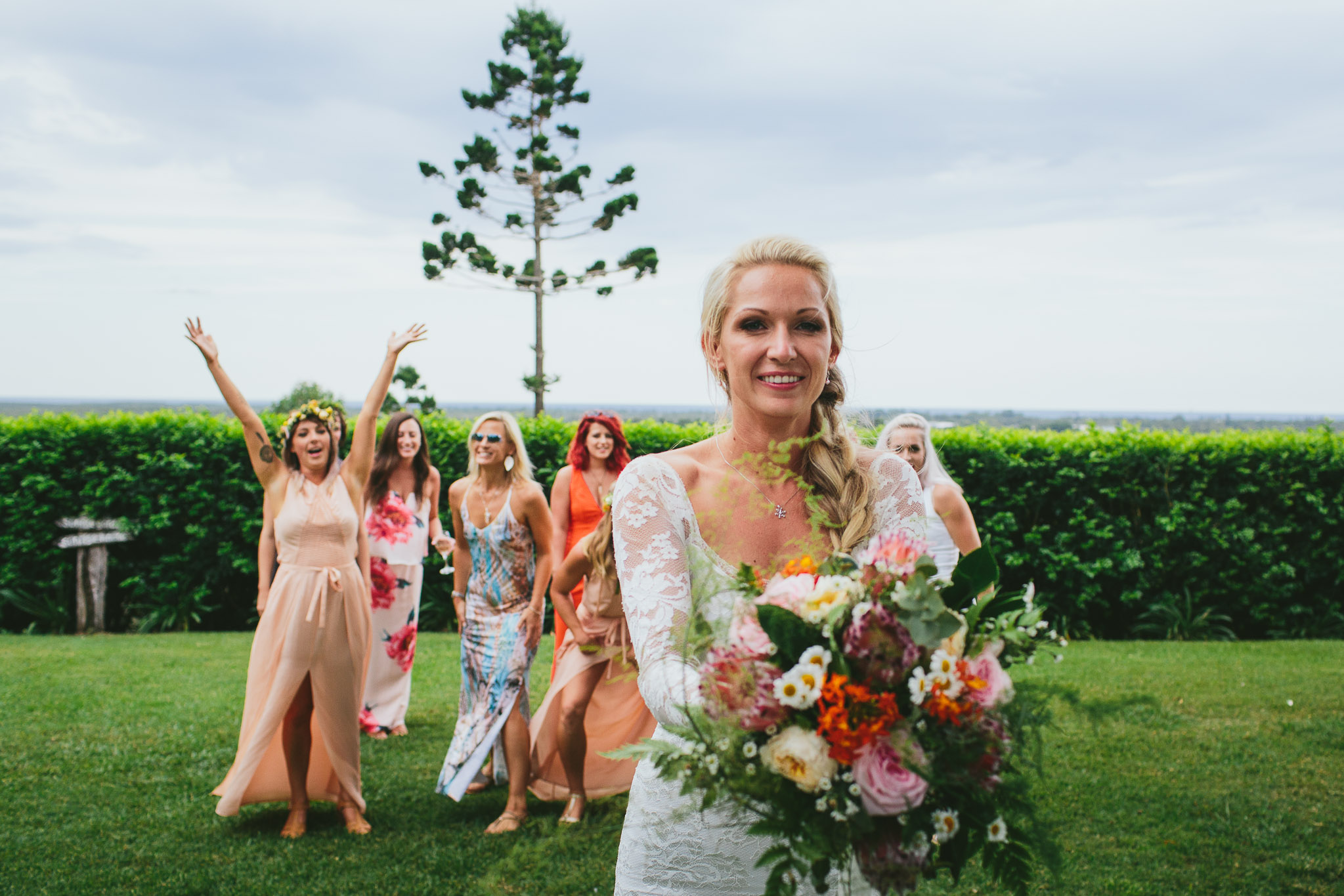 Byron Bay weddings bride throwing of her bouquet
