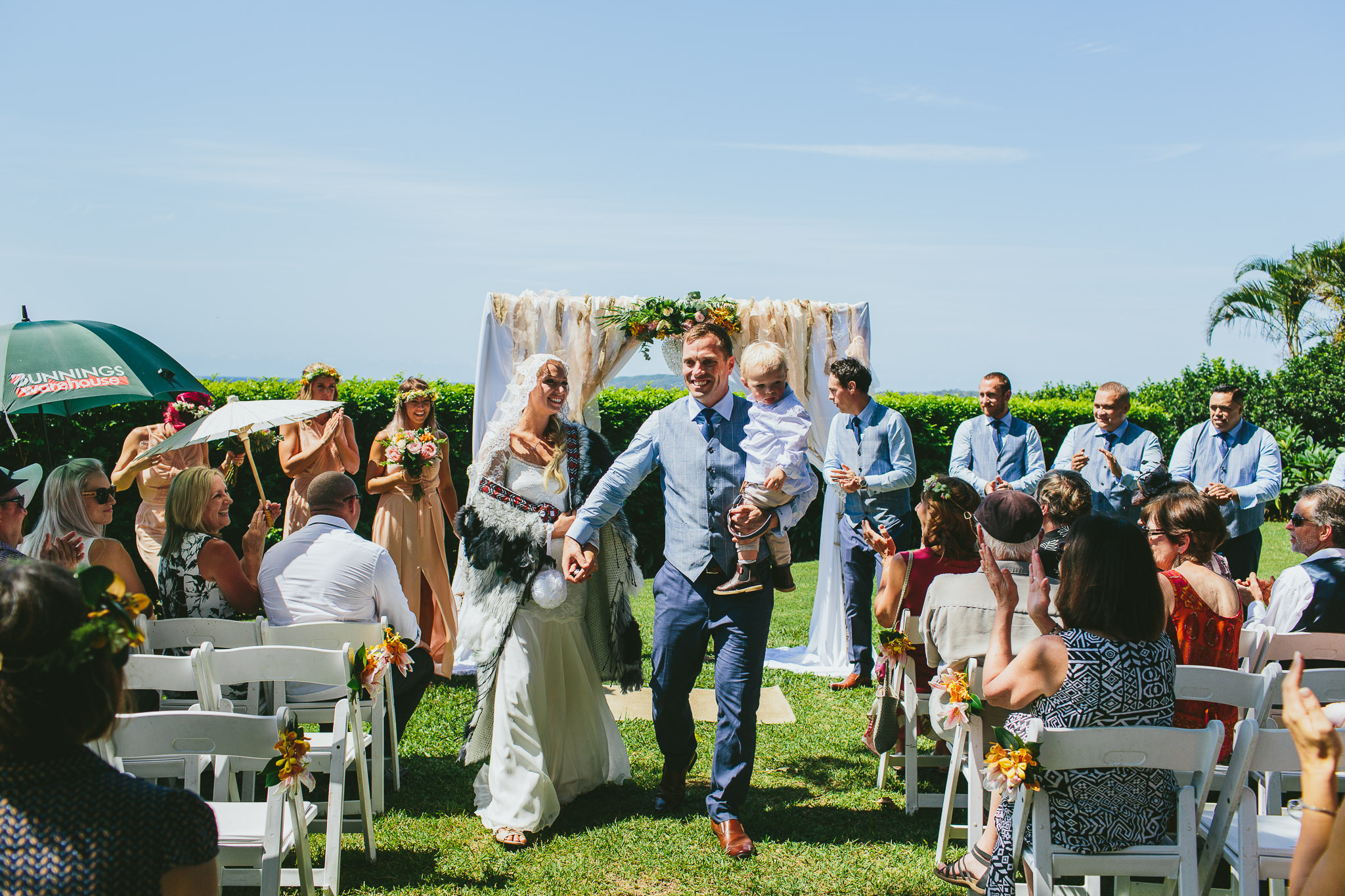 Byron Bay weddings bride and groom walking down aisle