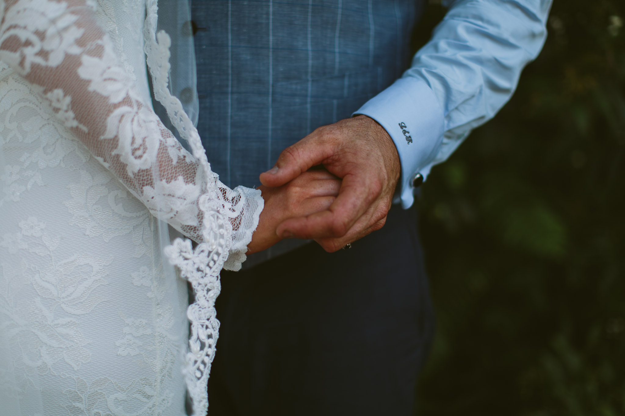Byron Bay weddings bride and groom holding hands