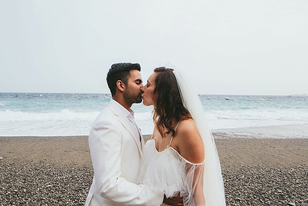 Positano wedding bride and groom kissing