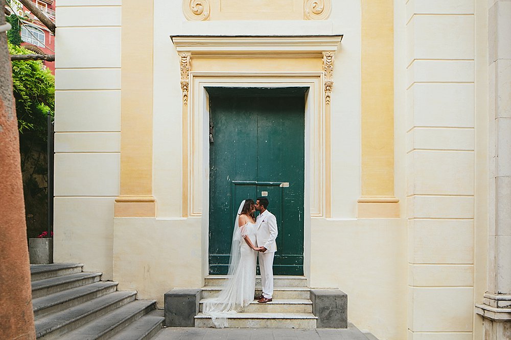 kisses in the streets of Positano wedding