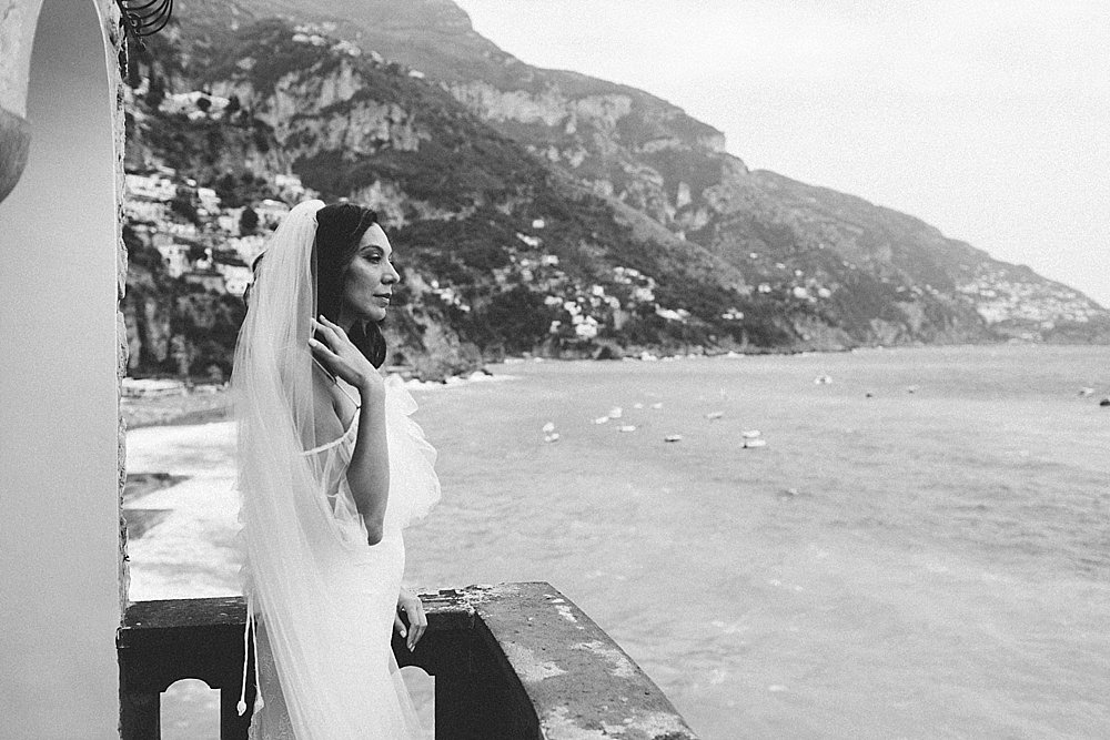 Positano wedding bride looking out of a balcony