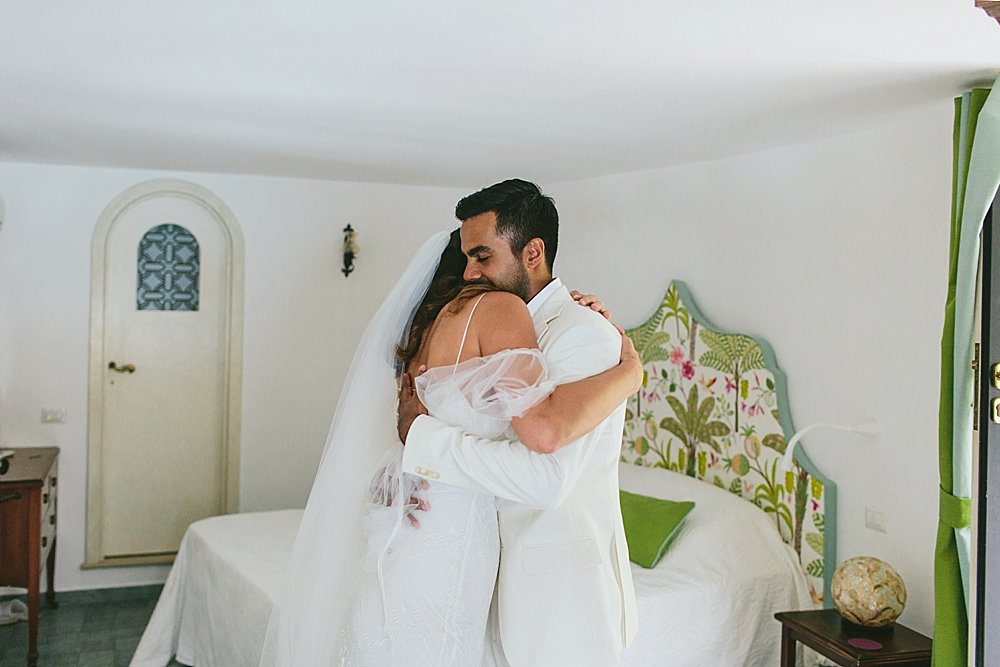 Positano wedding first look hugs 