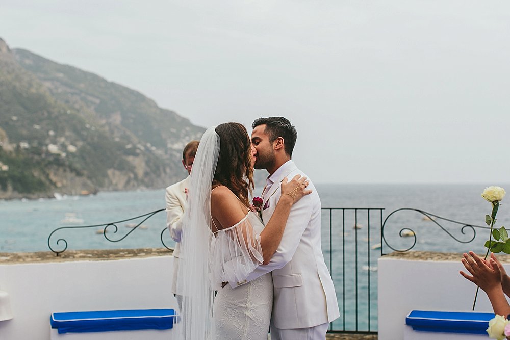 Positano wedding ceremony kiss