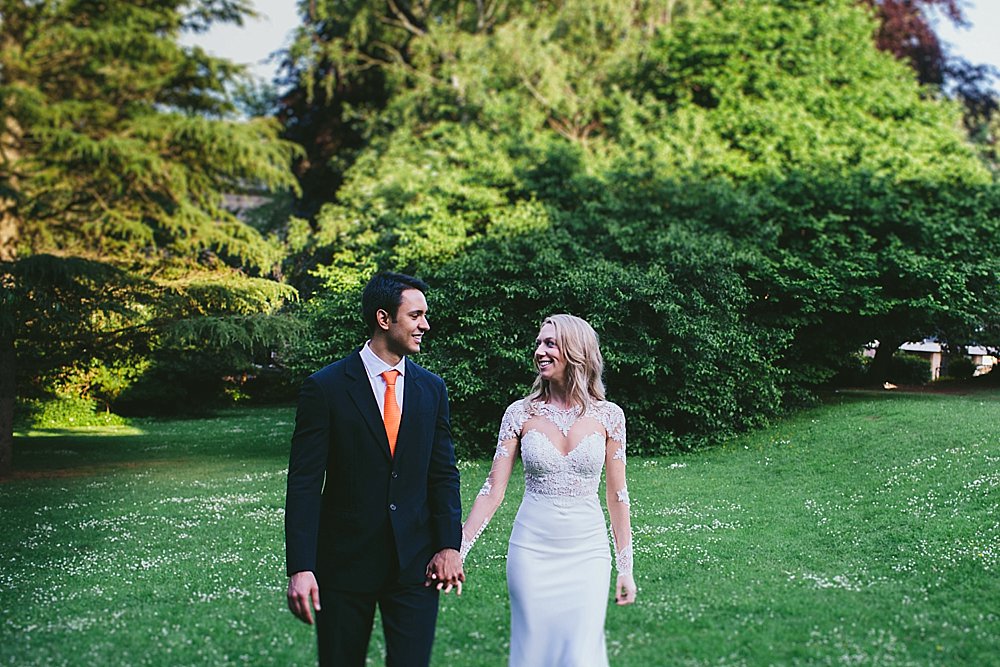 Bristol wedding bride and groom in the park holding hands
