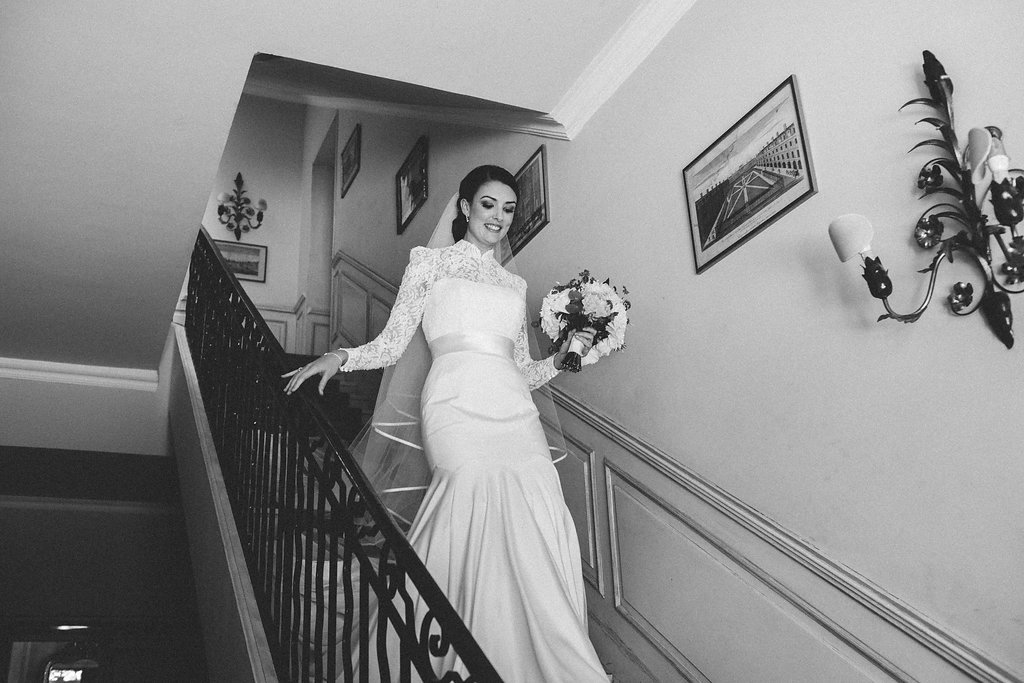 Provence wedding bride walking down the stairs towards her father
