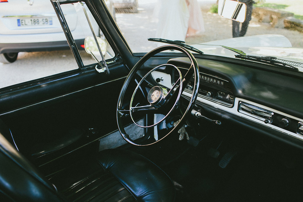 behind the wheel of a Peugeot 404 weddings