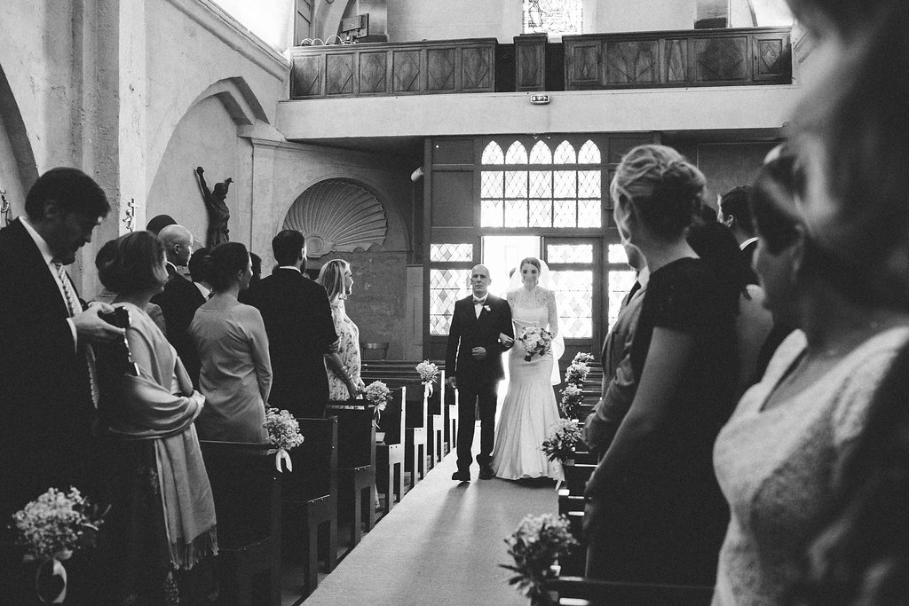 bride and father walking down the aisle
