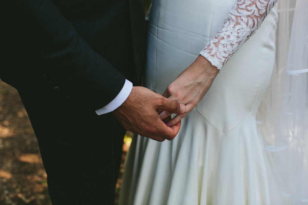 Provence wedding bride and groom holding hands