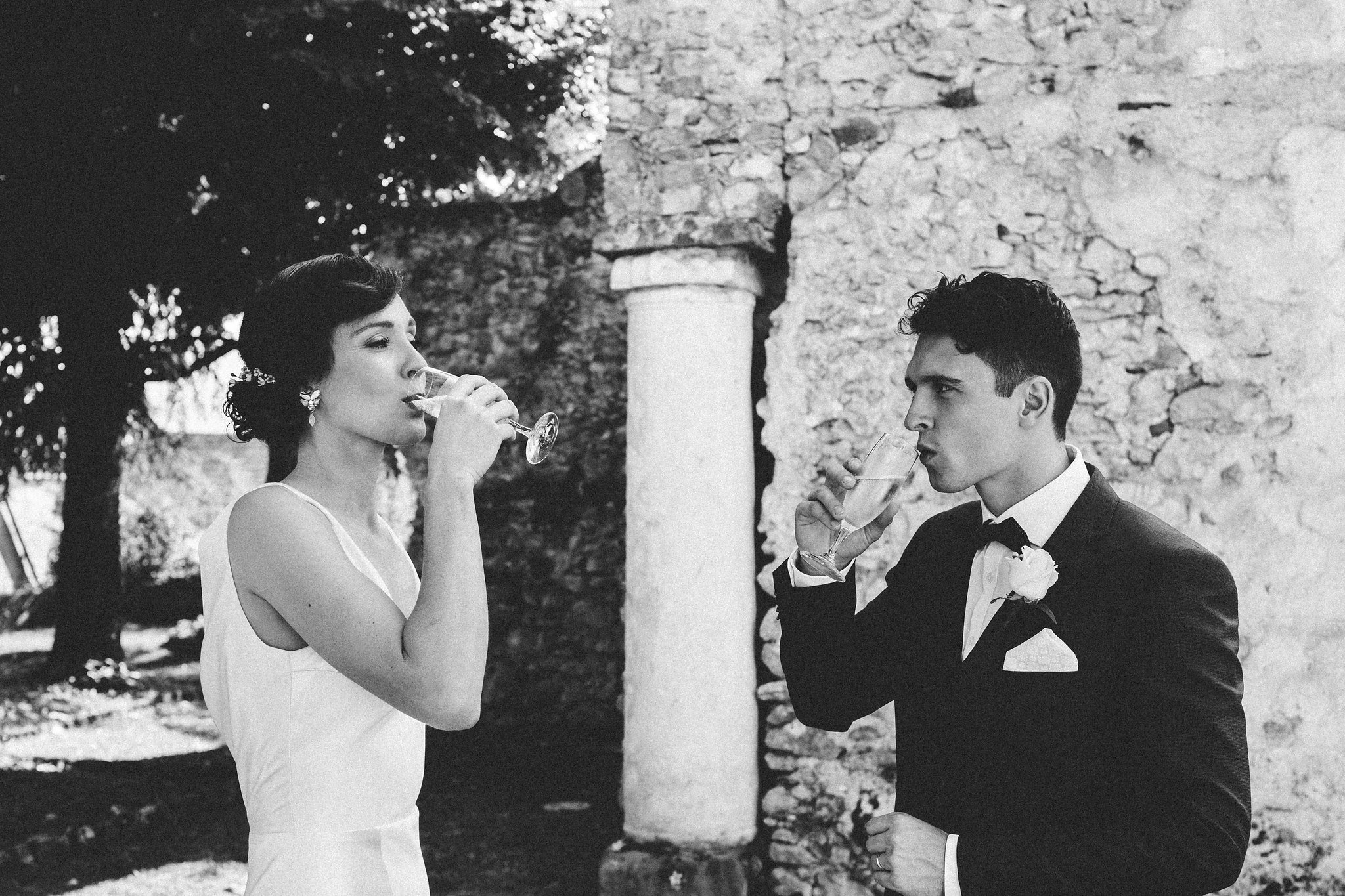 Italian weddings bride and groom drinking champagne