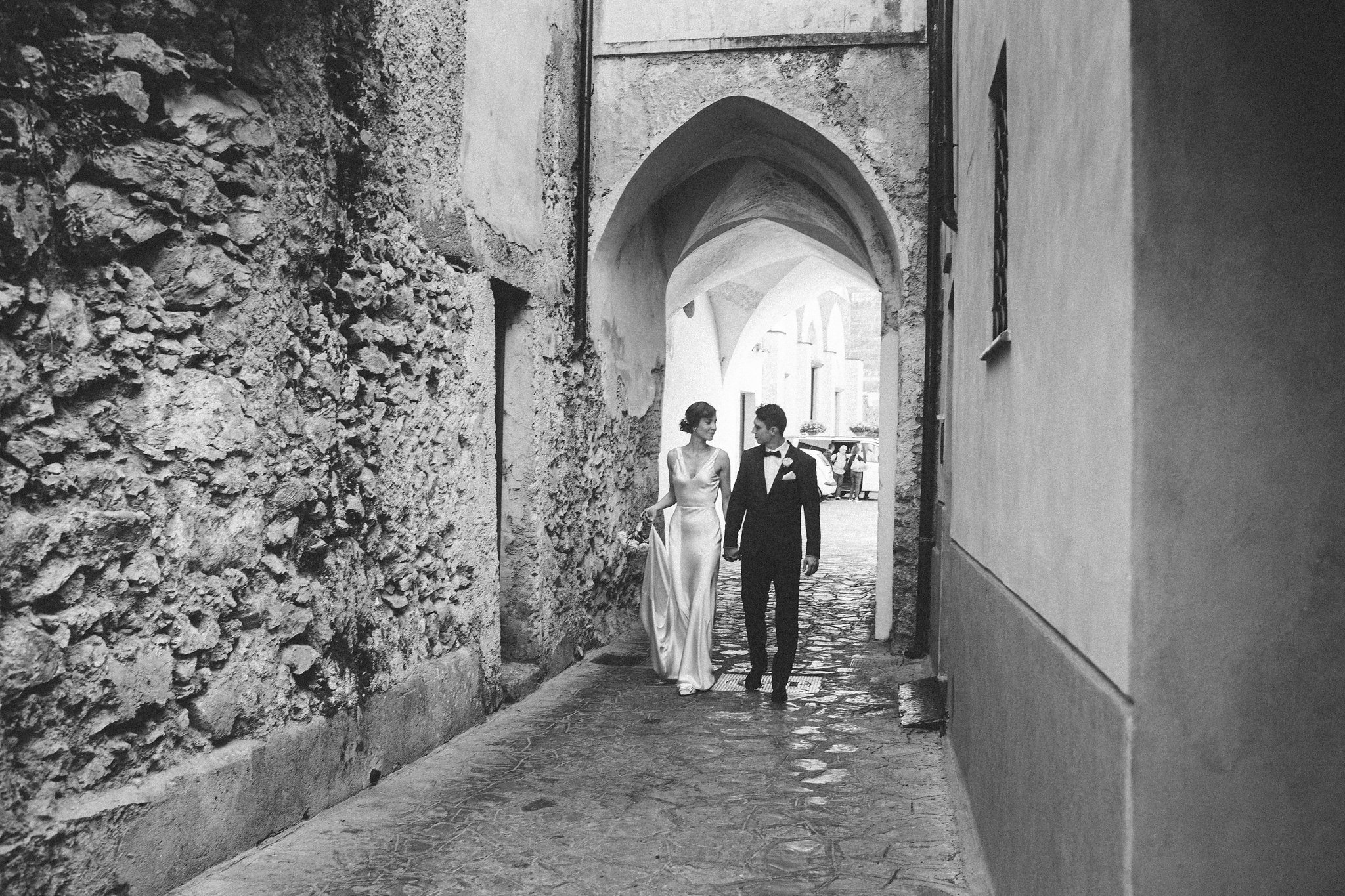 Italian weddings bride and groom walking through the streets of Ravello