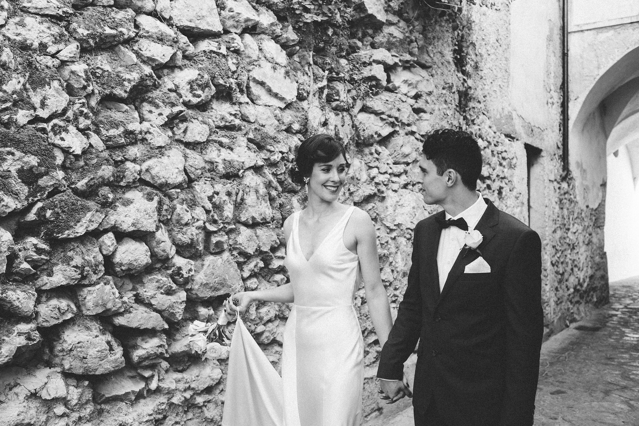 Italian weddings bride and groom holding hands in the streets of Ravello