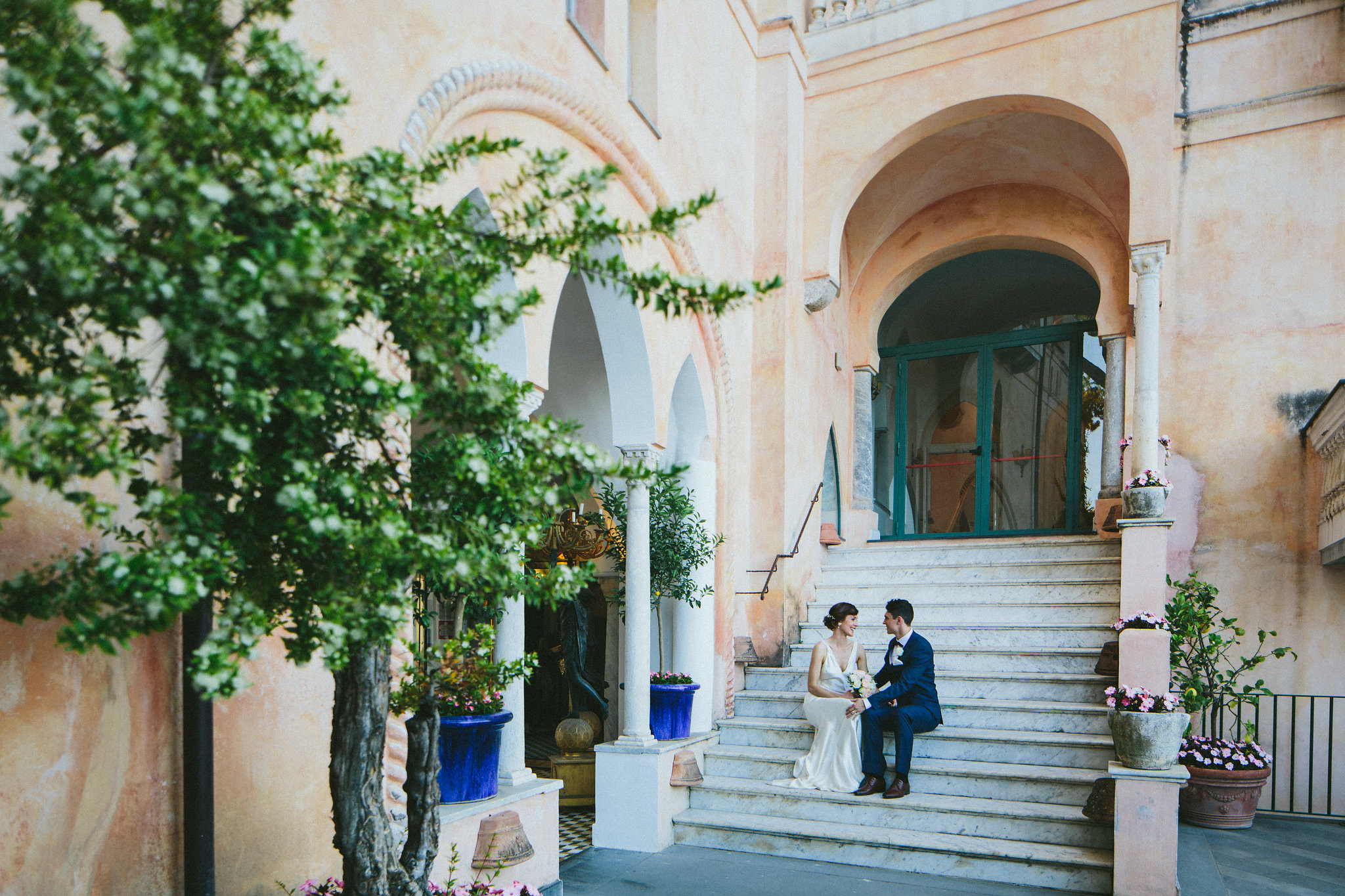 Italian weddings Bride and groom stairs of a grande hotel