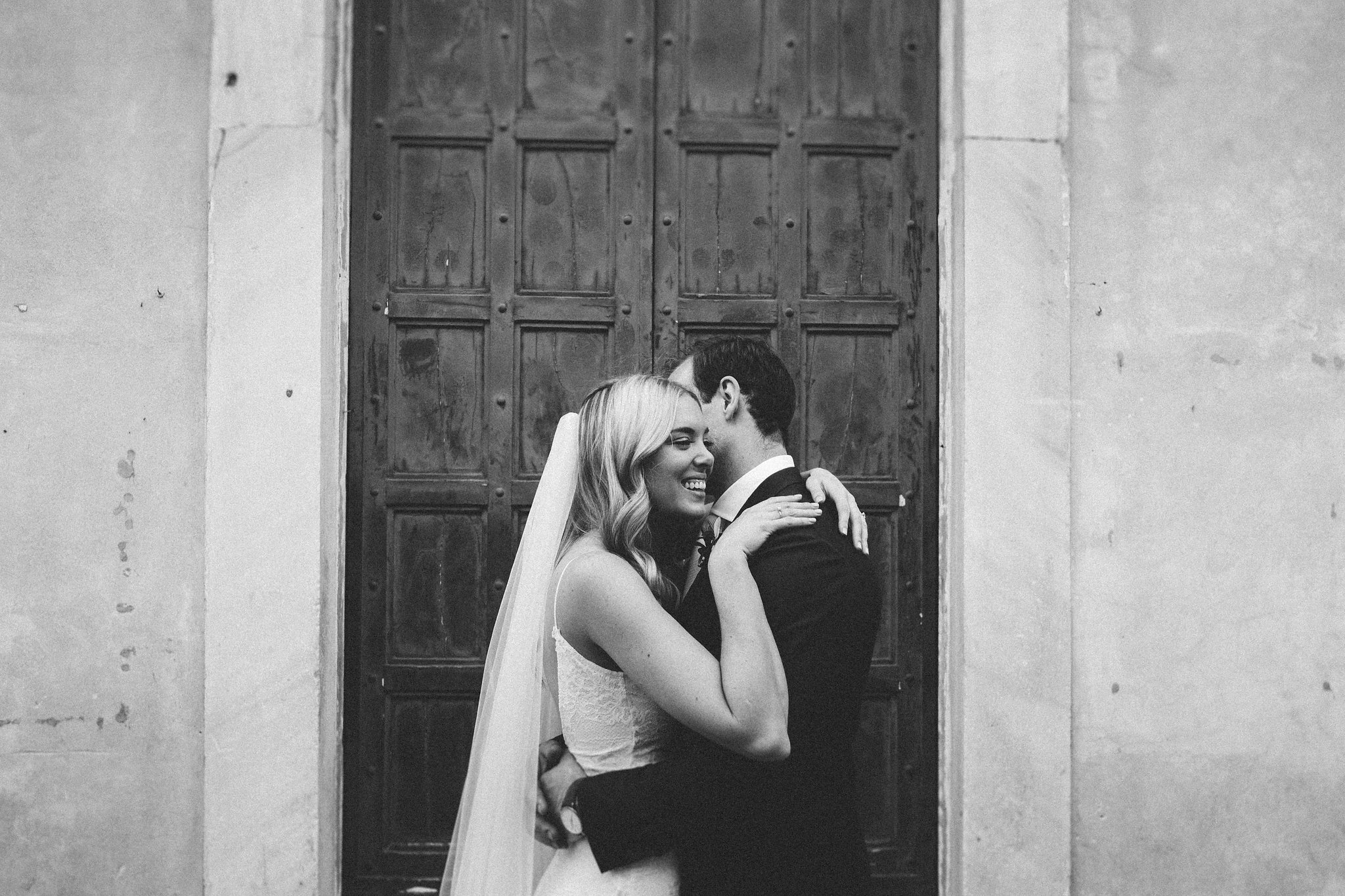 Italian wedding Bride and groom hugs smiles