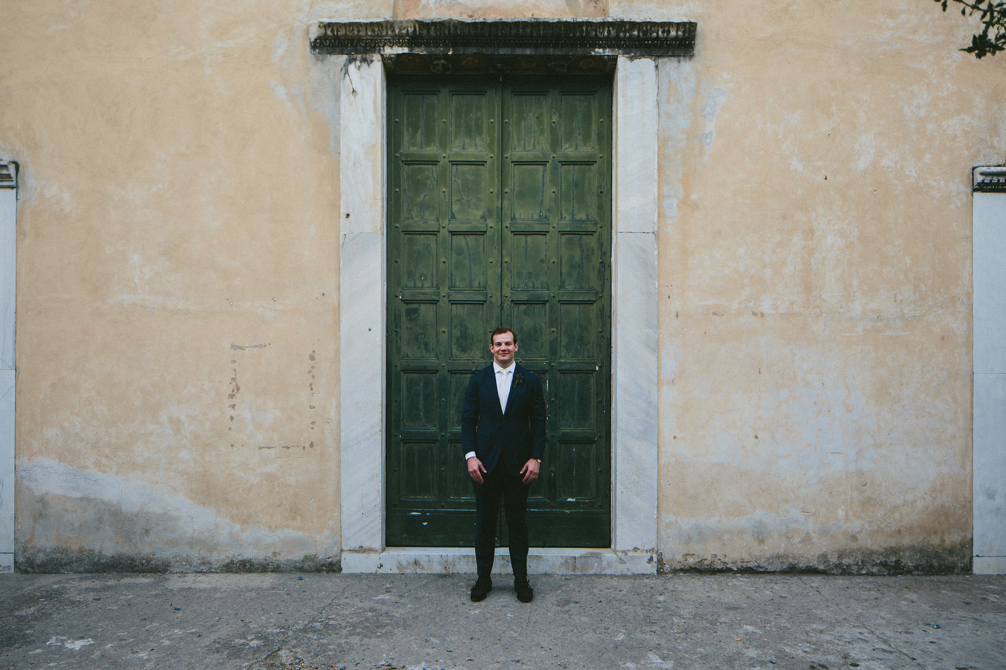 Church doors Ravello Italy groom portrait