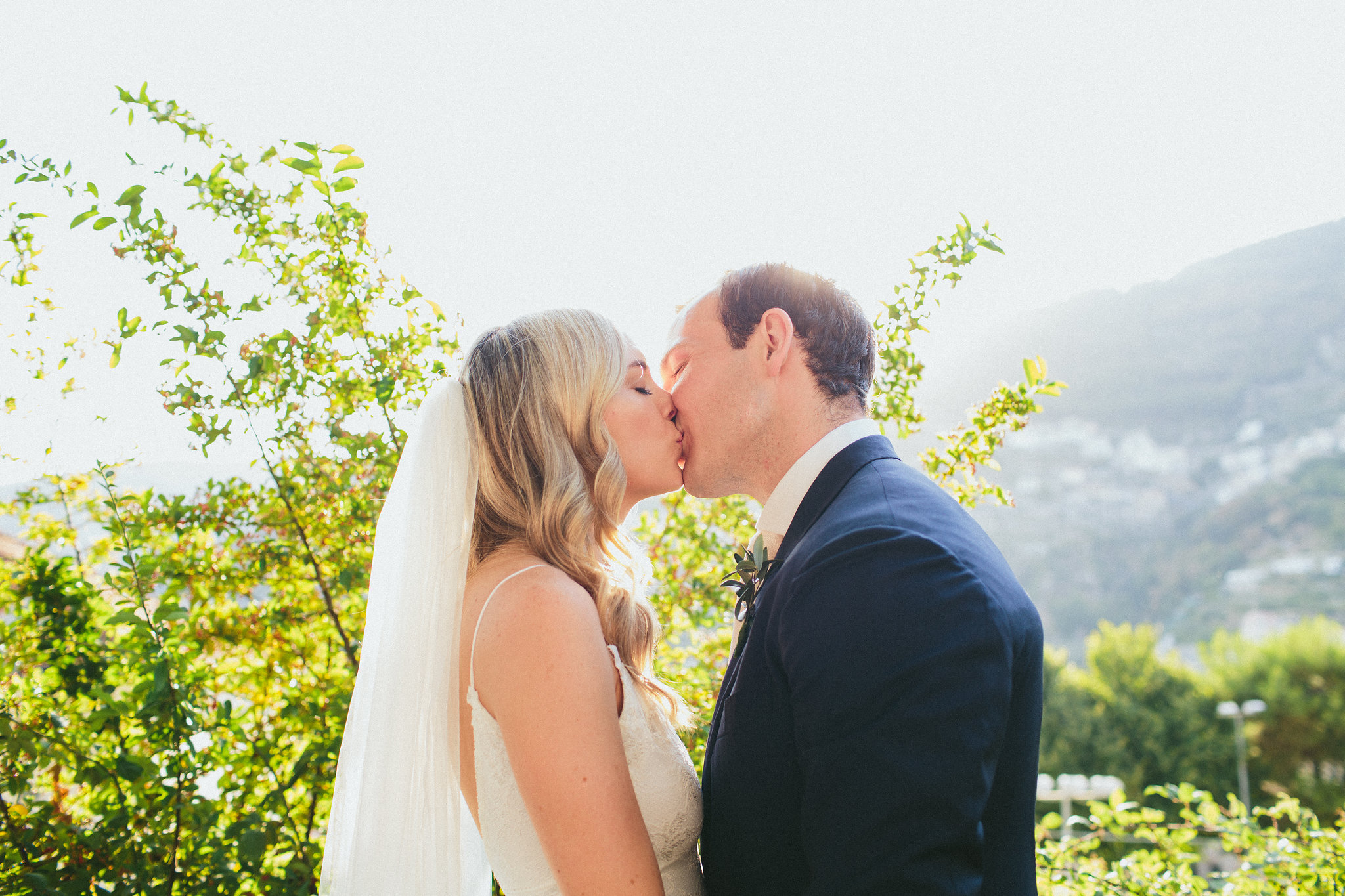 Bride and groom kiss Ravello Italy wedding