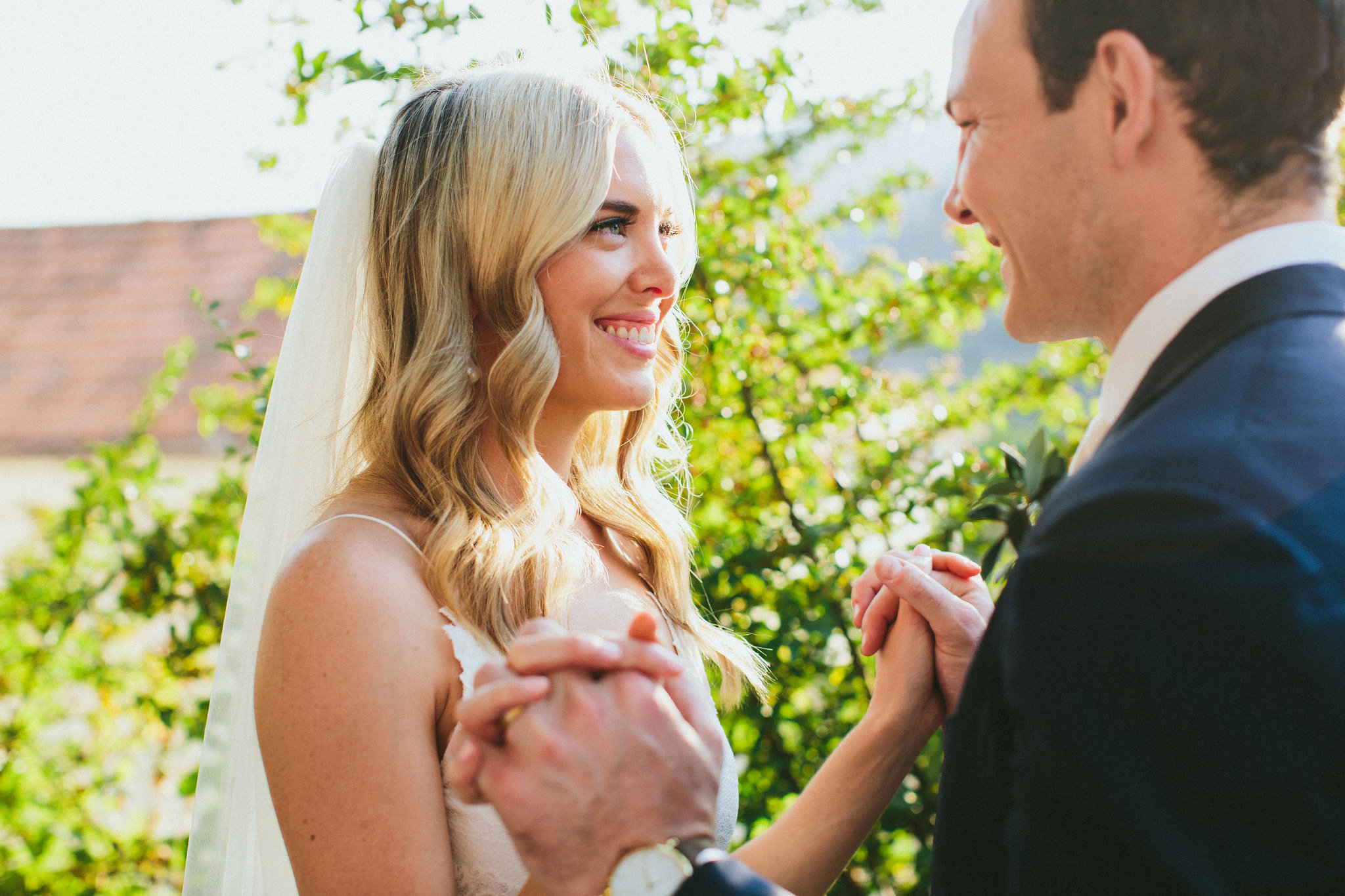 Bride and groom hand in hand smiles Amalfi Coast wedding