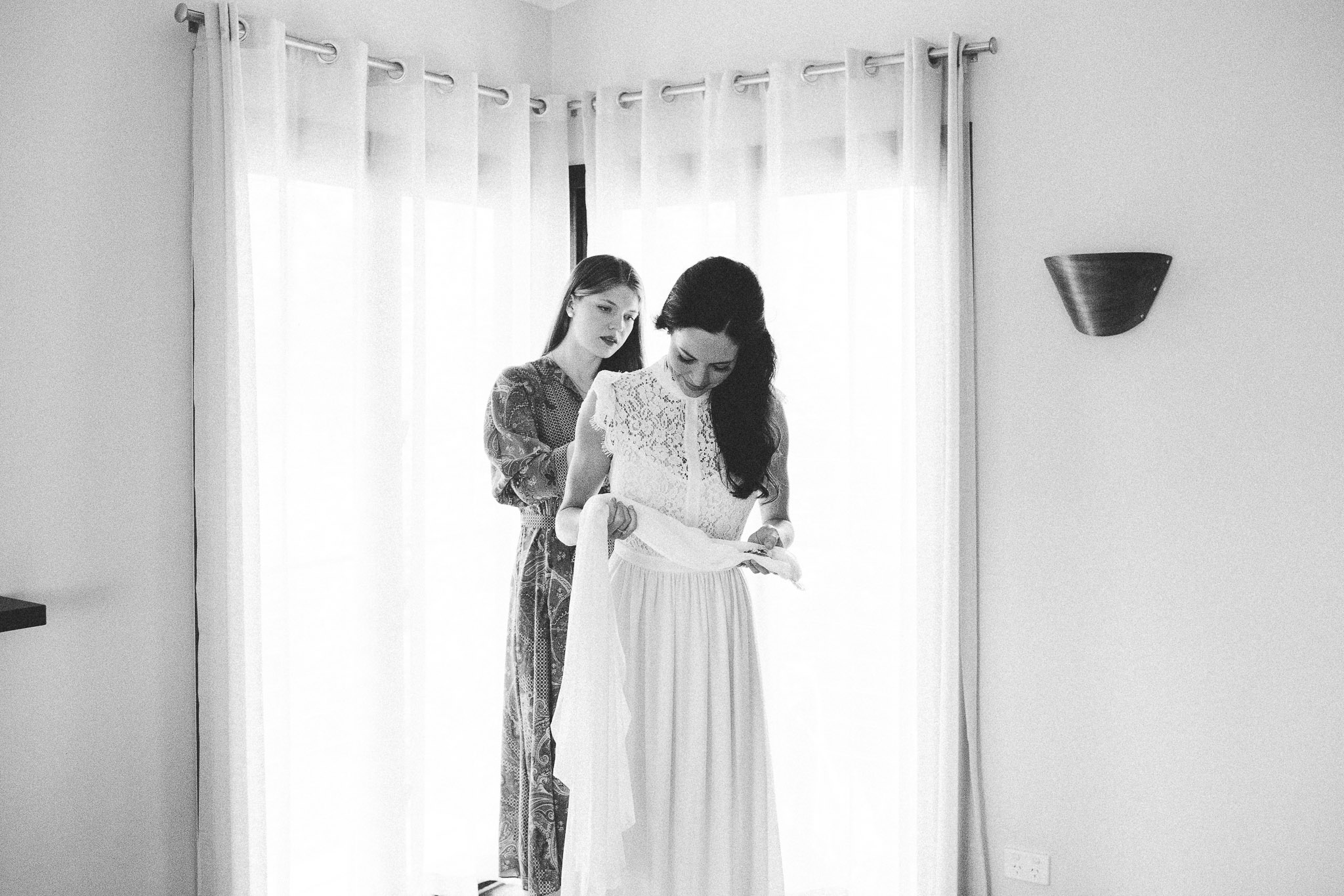 Sunshine Coast Australia Wedding Bridesmaid helping bride get ready