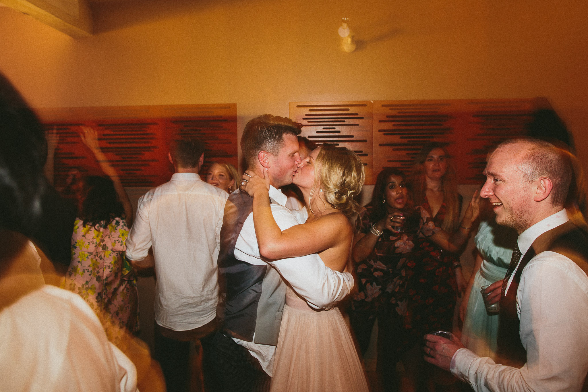 bride and groom kissing on the dance-floor 