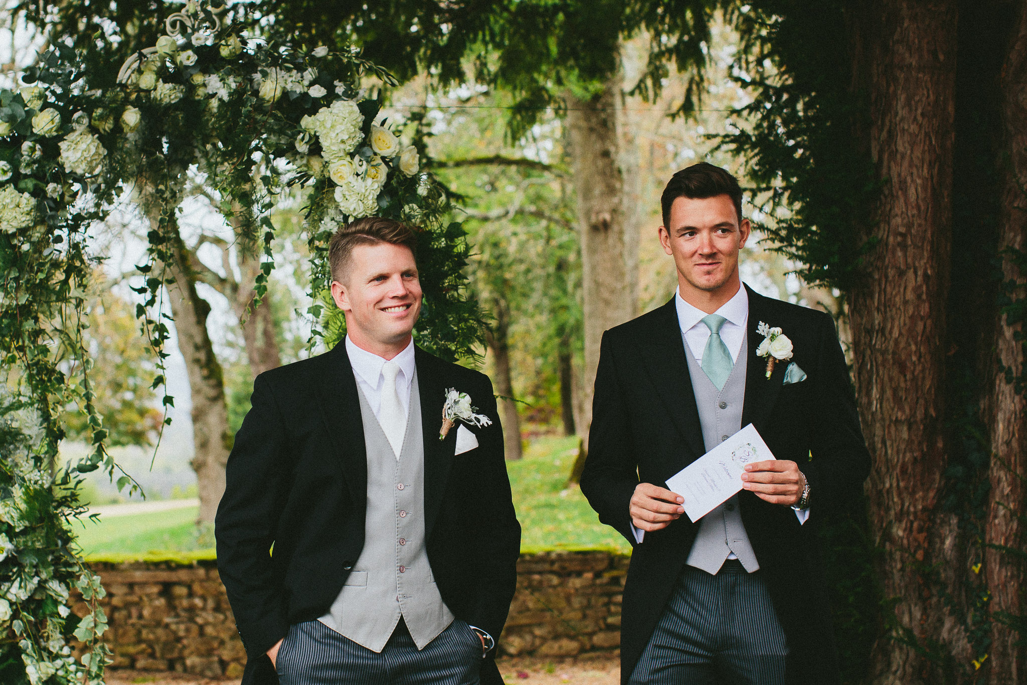 groom waiting at the end of the aisle