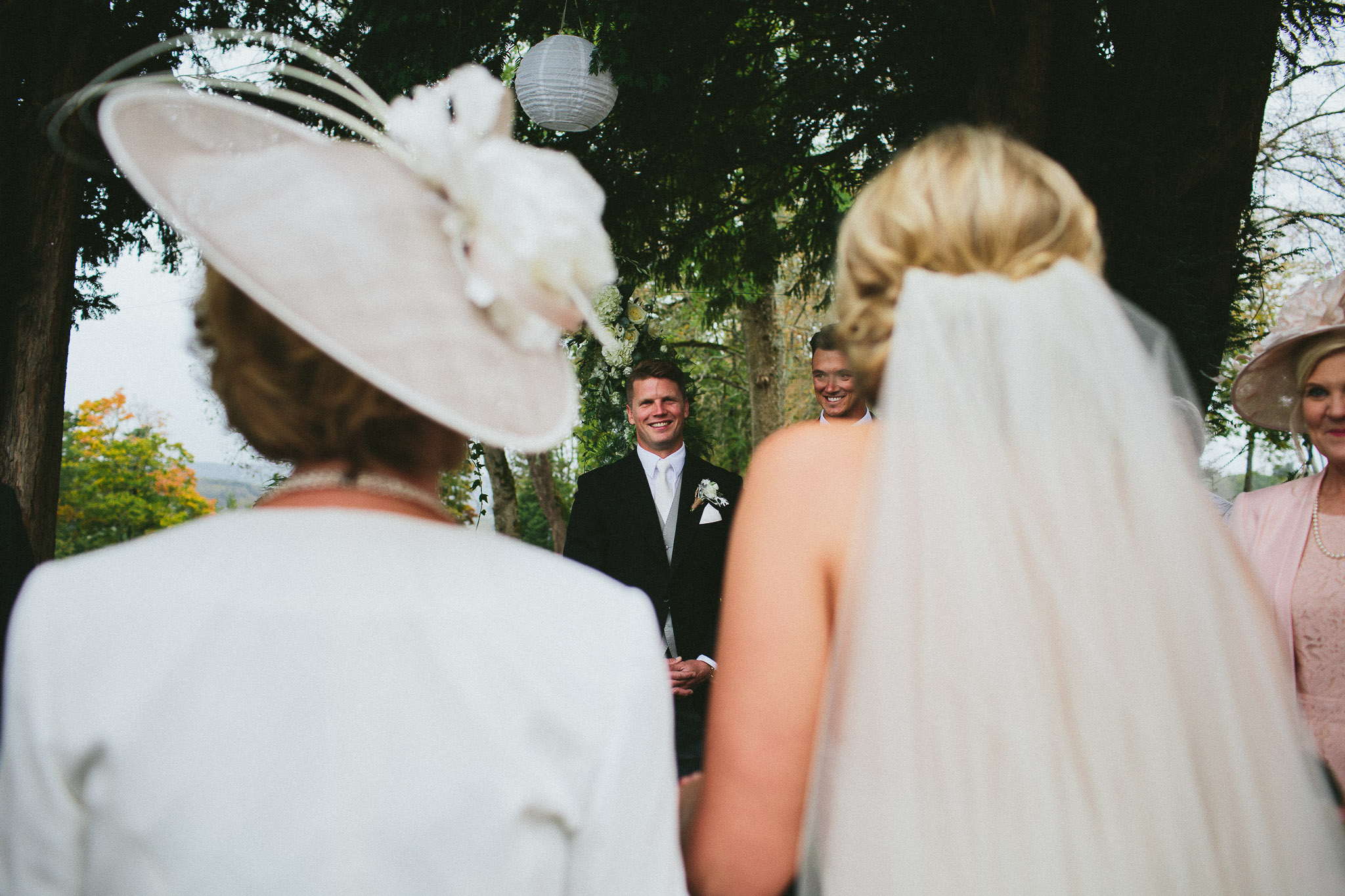 A french destination wedding groom waiting for his bride at the end of the aisle