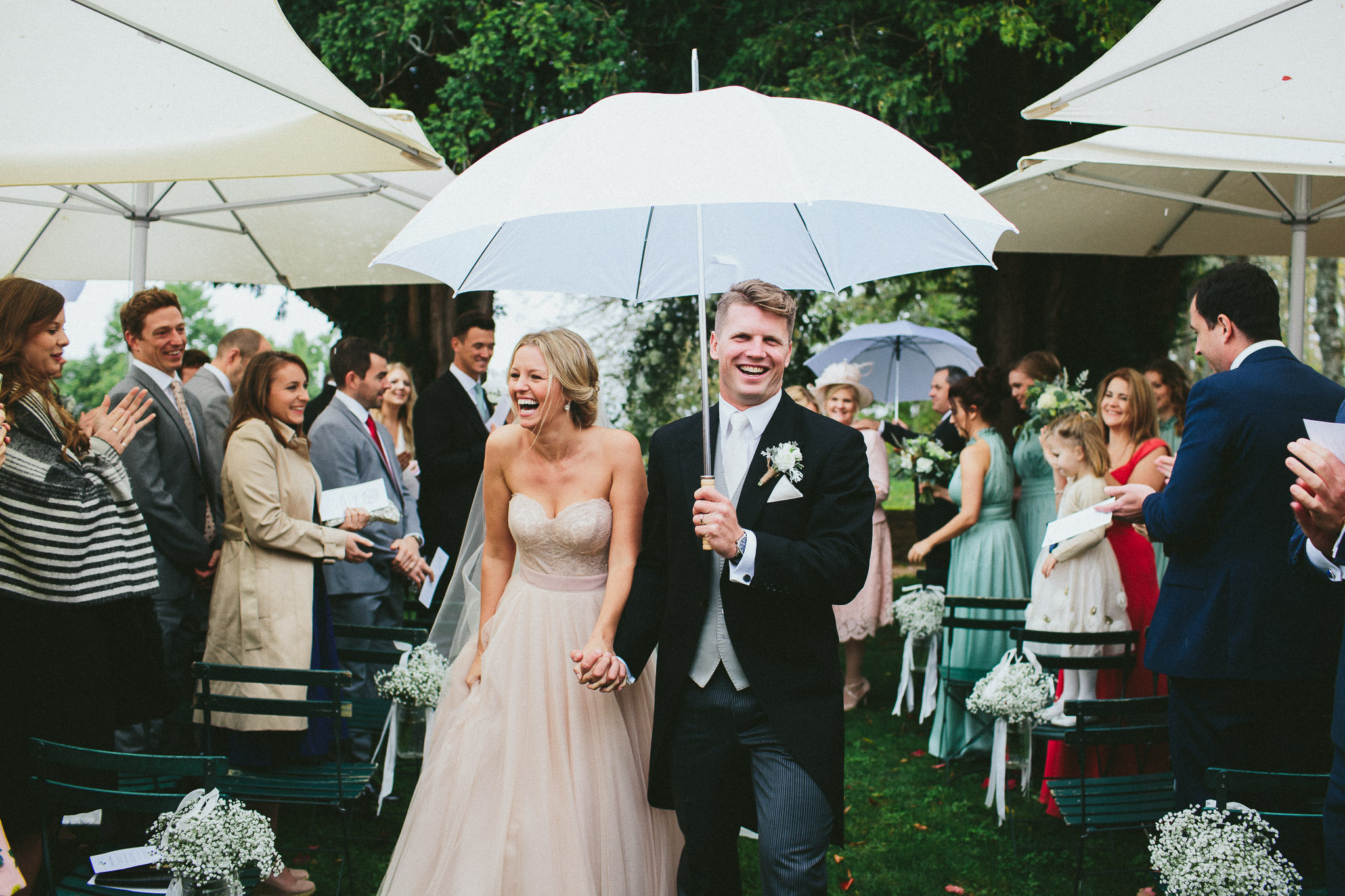A french destination wedding ceremony bride and groom walking down the aisle