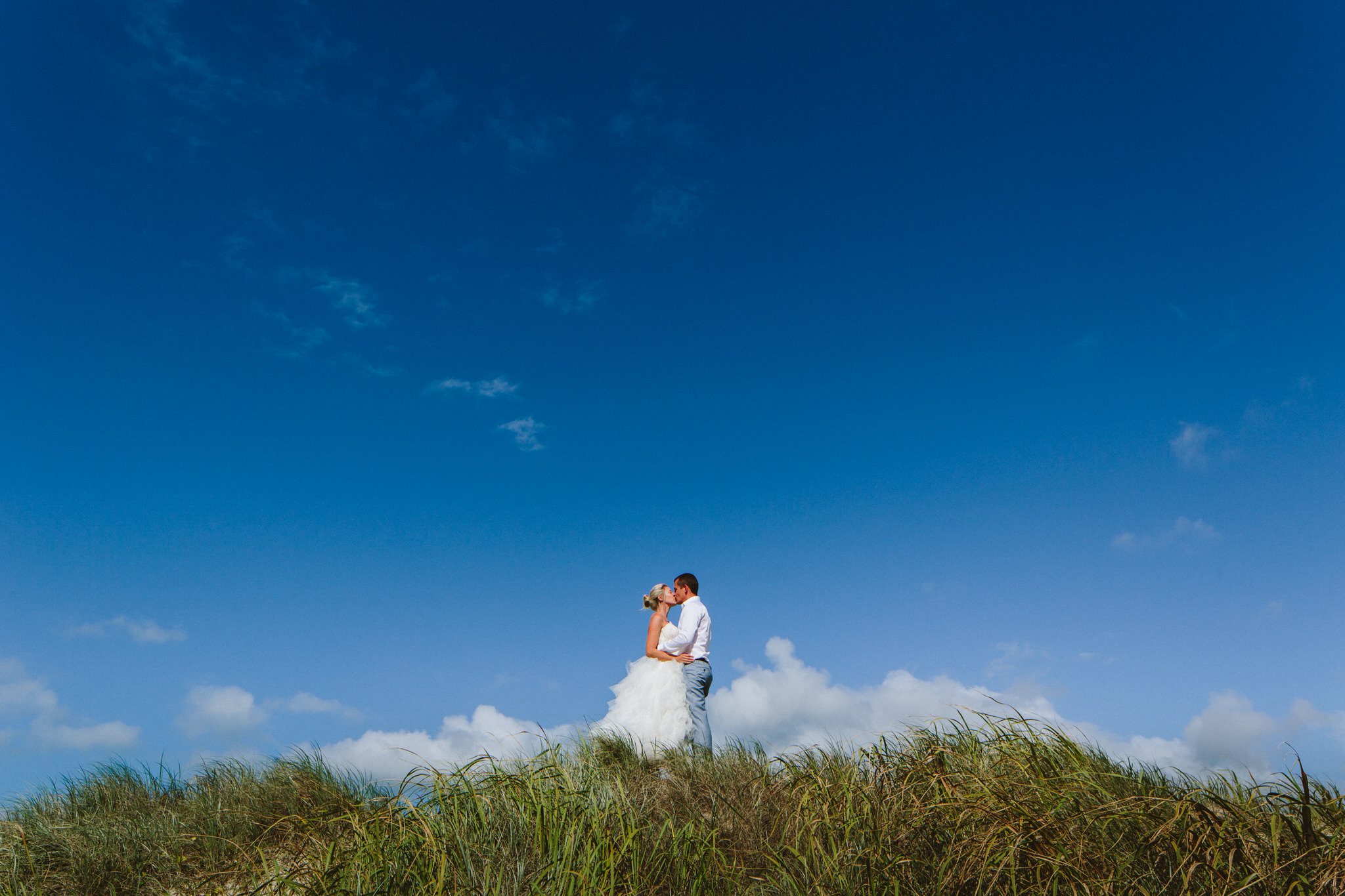 A Year's Journey Through Photography Kissing in the clouds bride and groom