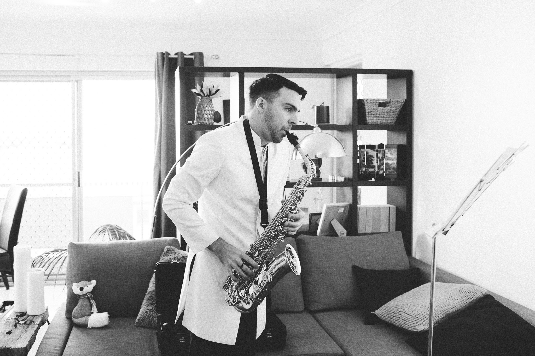 groom playing the saxophone 