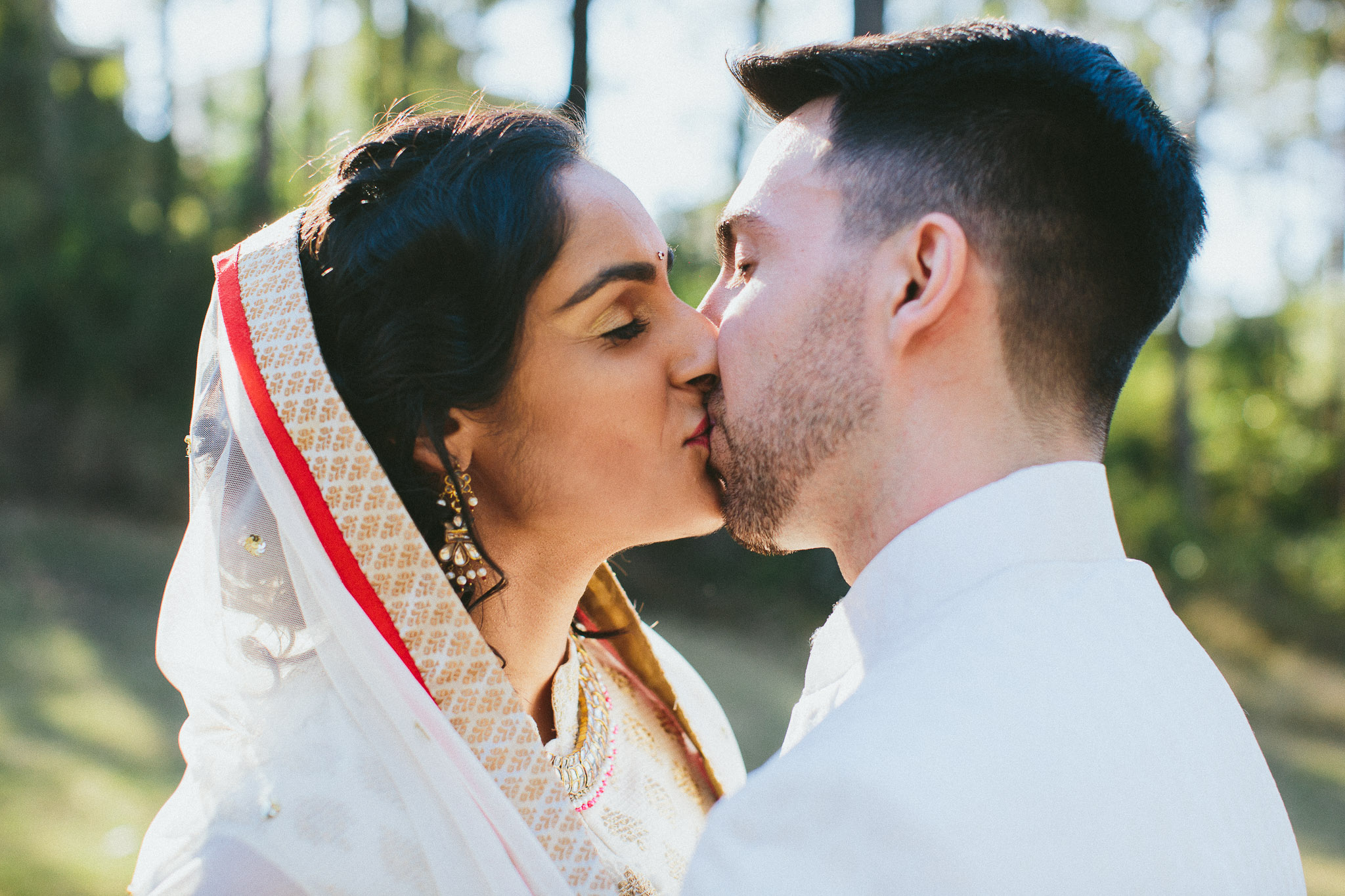 Bride groom kissing Indian wedding 