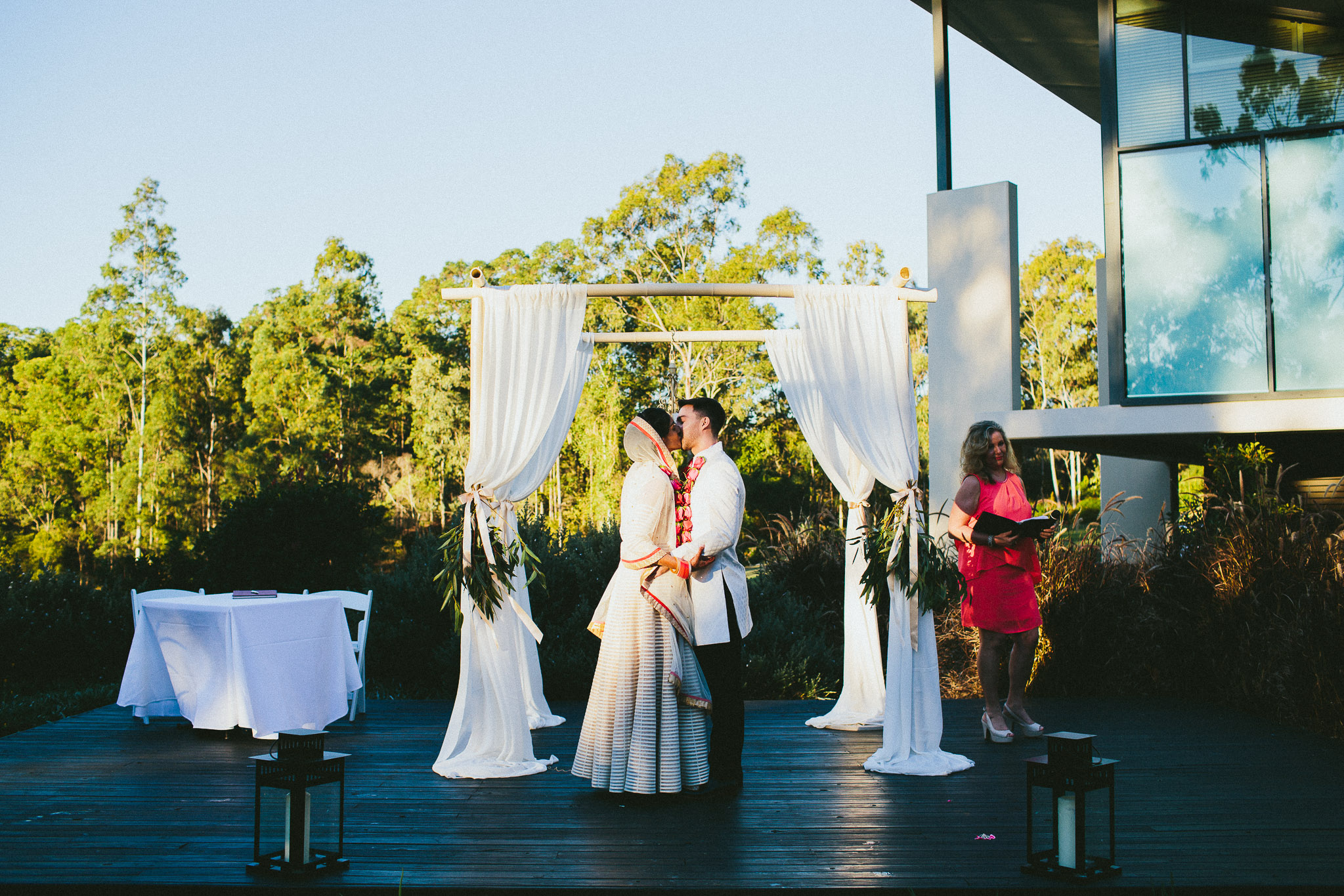 Bride and groom kissing at Indian wedding ceremony