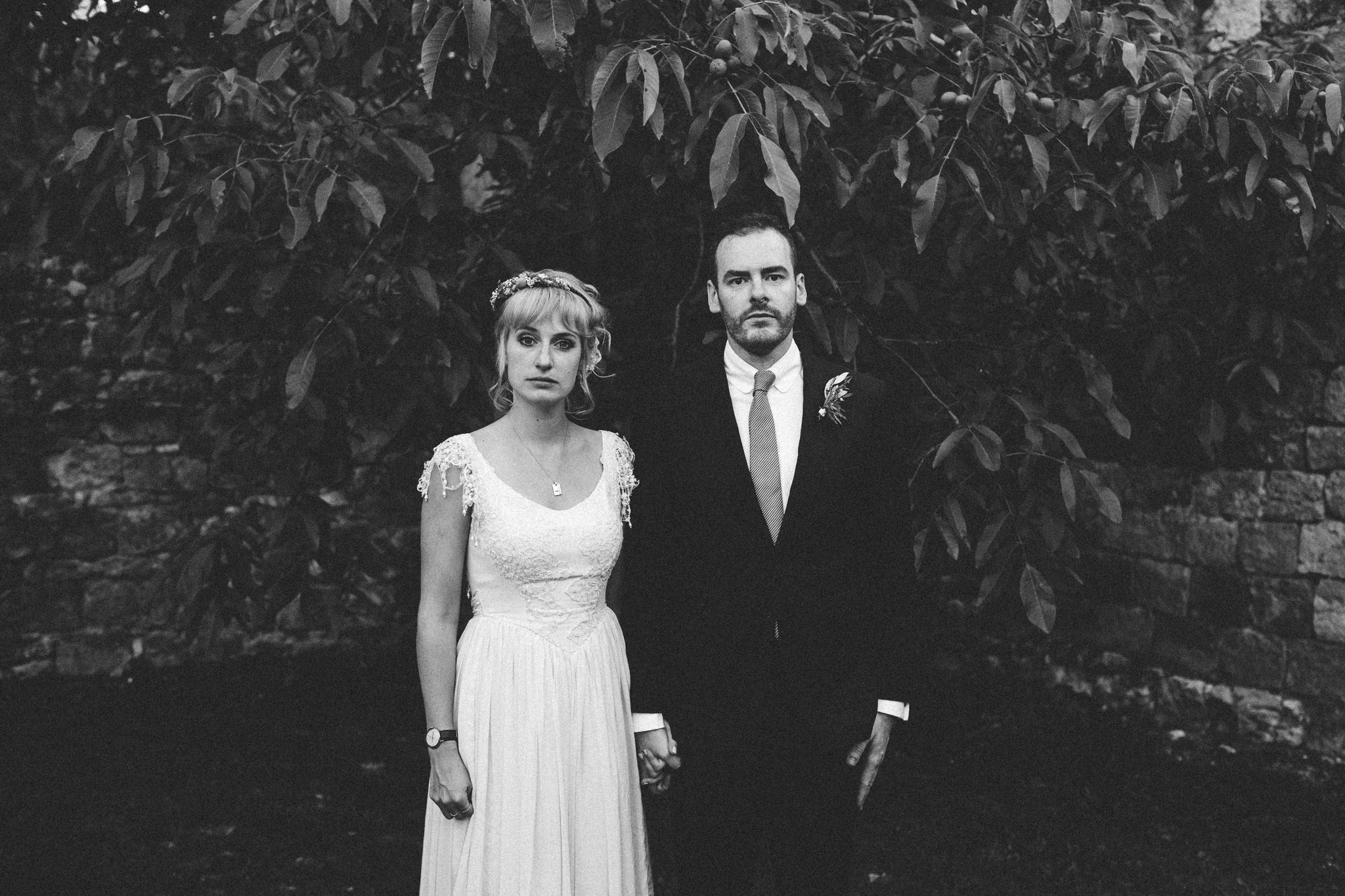 awkward funny look bride and groom staring at camera photoshoot