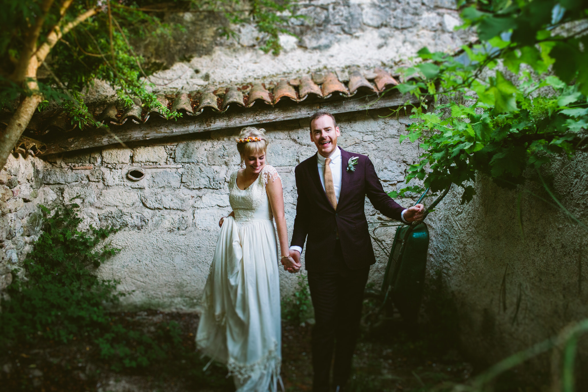 bride and groom dancing while walking photoshoot