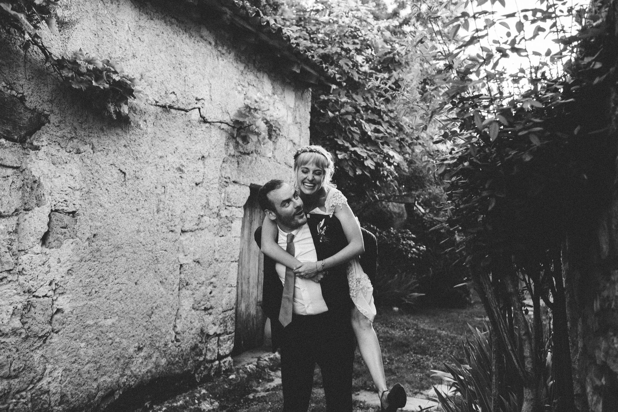 groom giving piggyback ride to bride fun