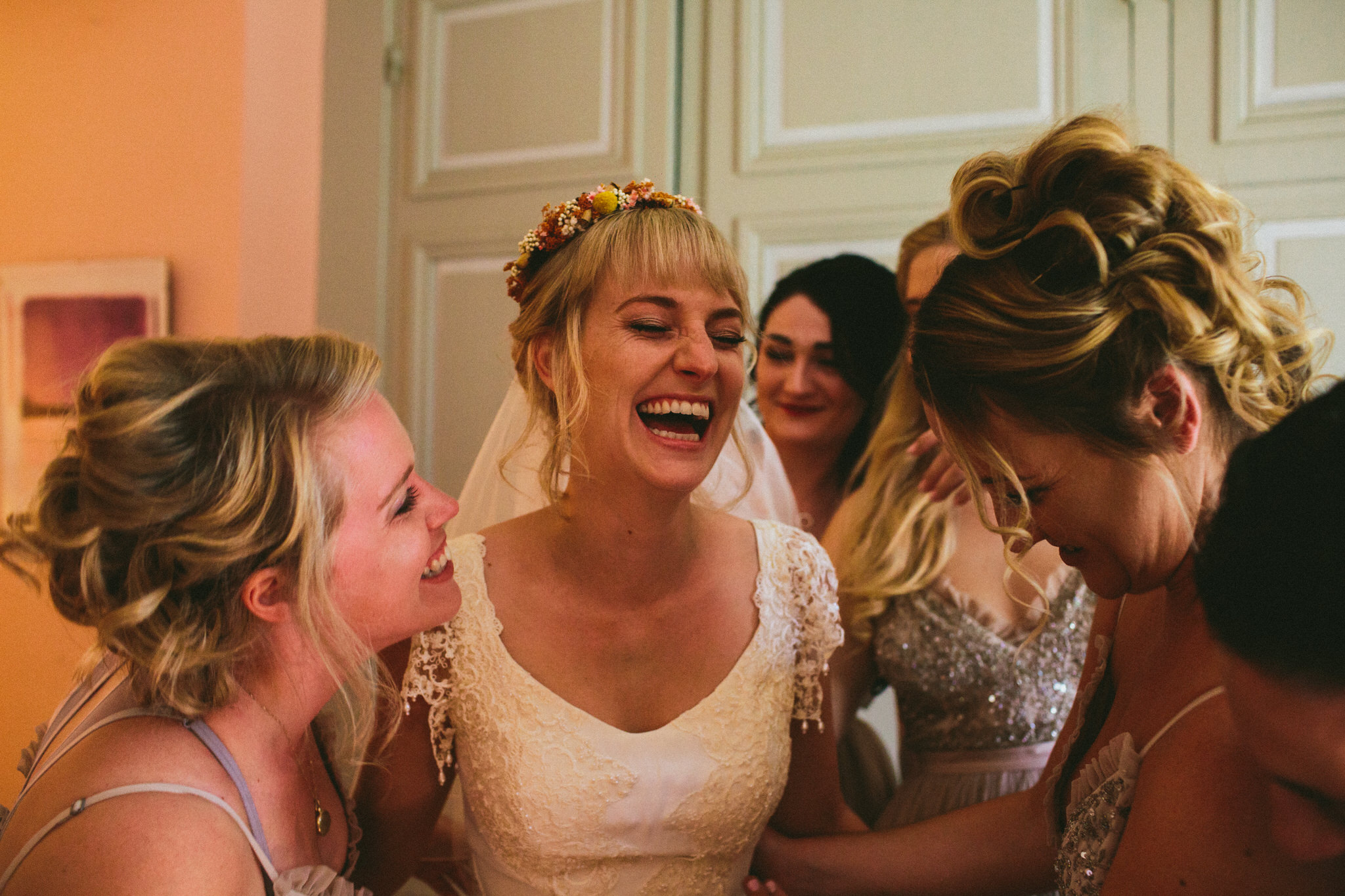 brides and bridesmaids dress up laughs french wedding