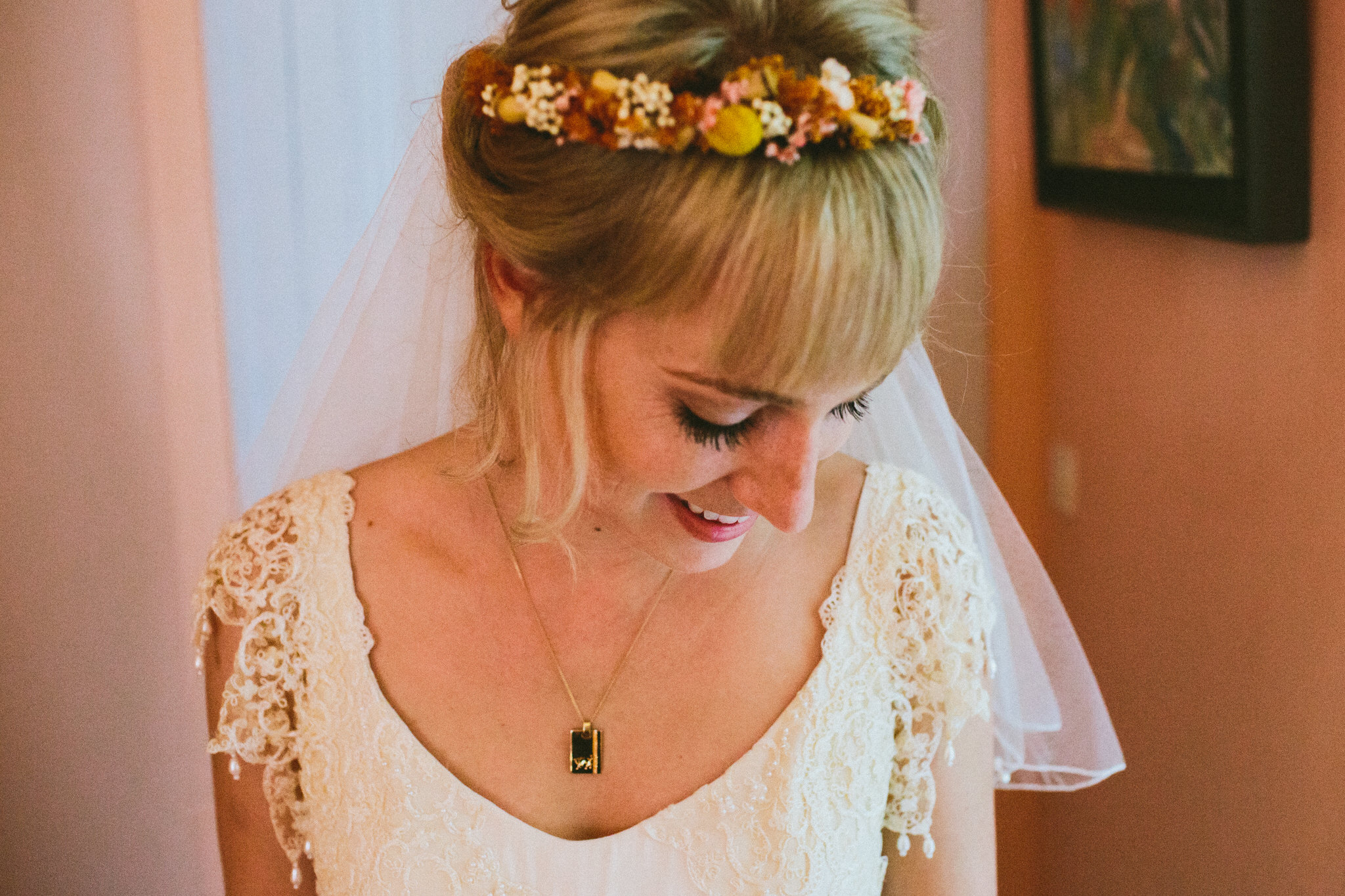 portrait bride looking down smiles french wedding