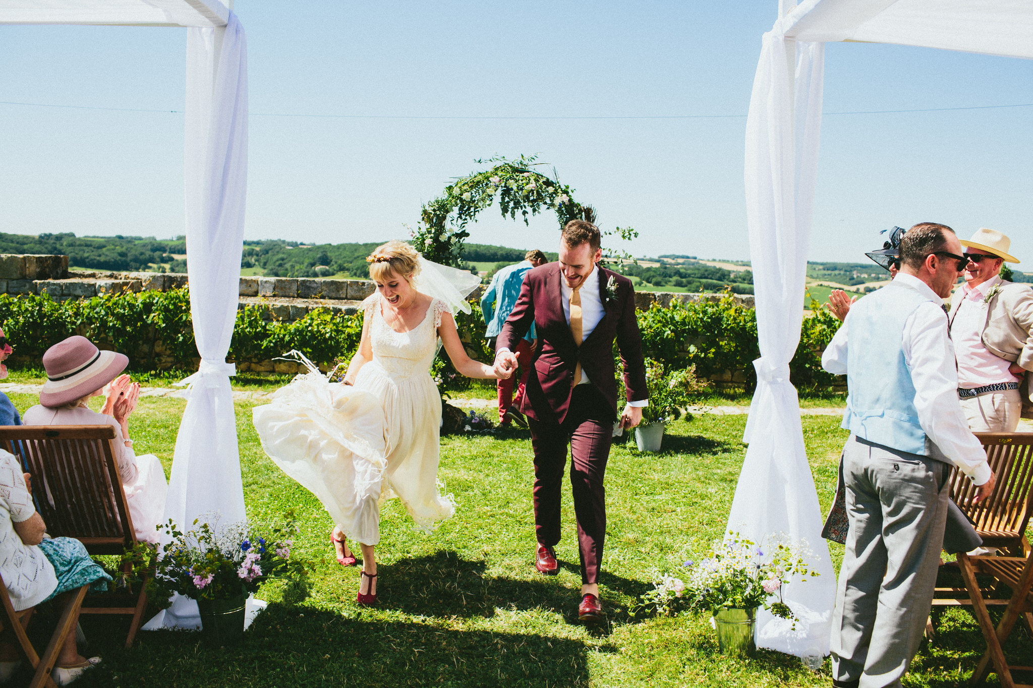 bride and groom walking down aisle french wedding