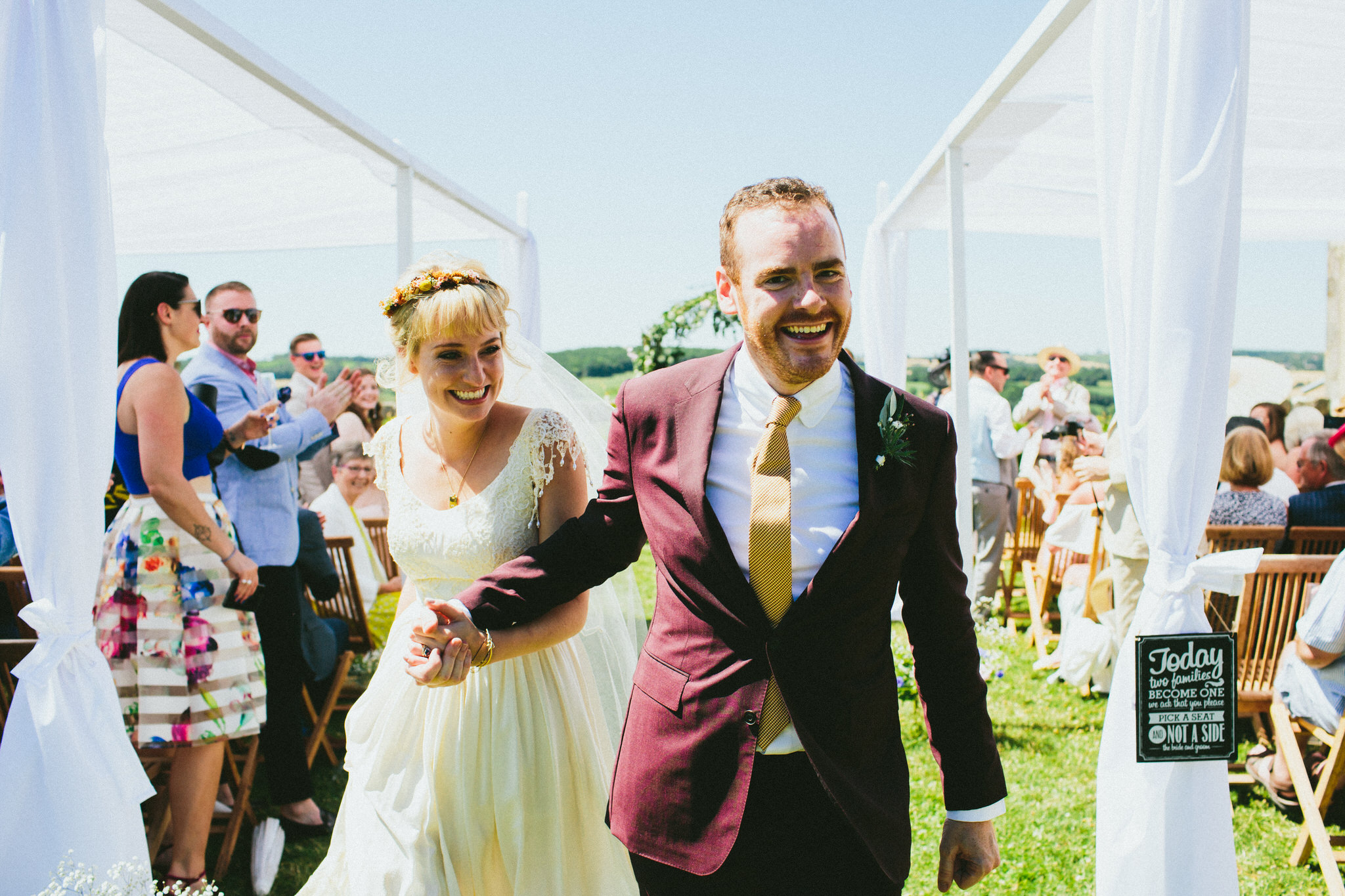 bride and groom smiles down the aisle french wedding
