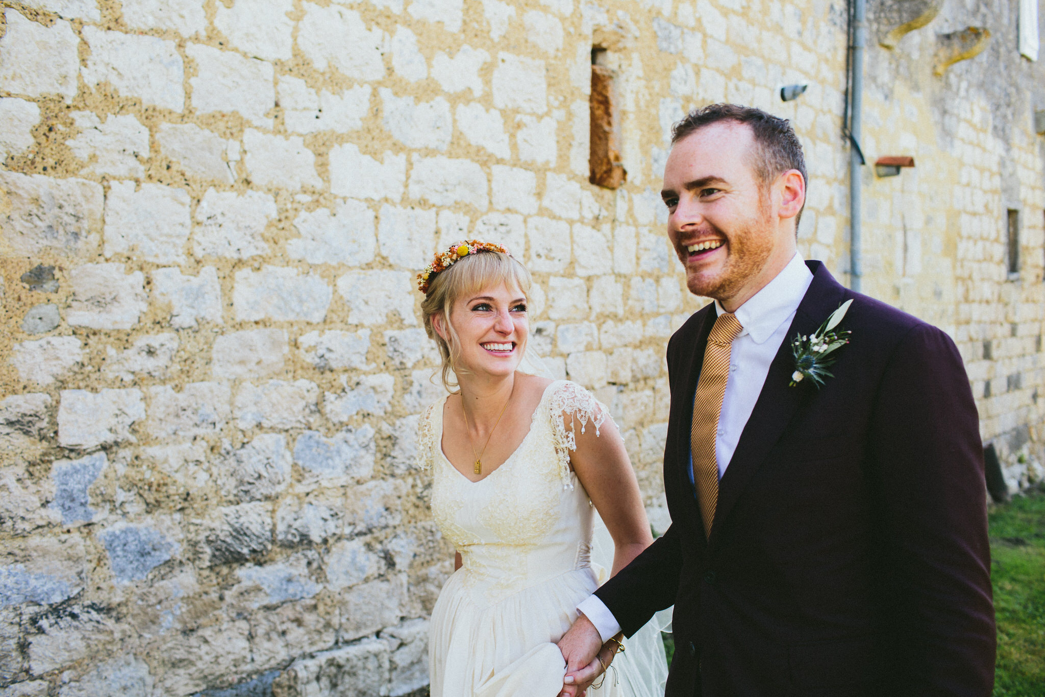 bride and groom walking and laughing photoshoot