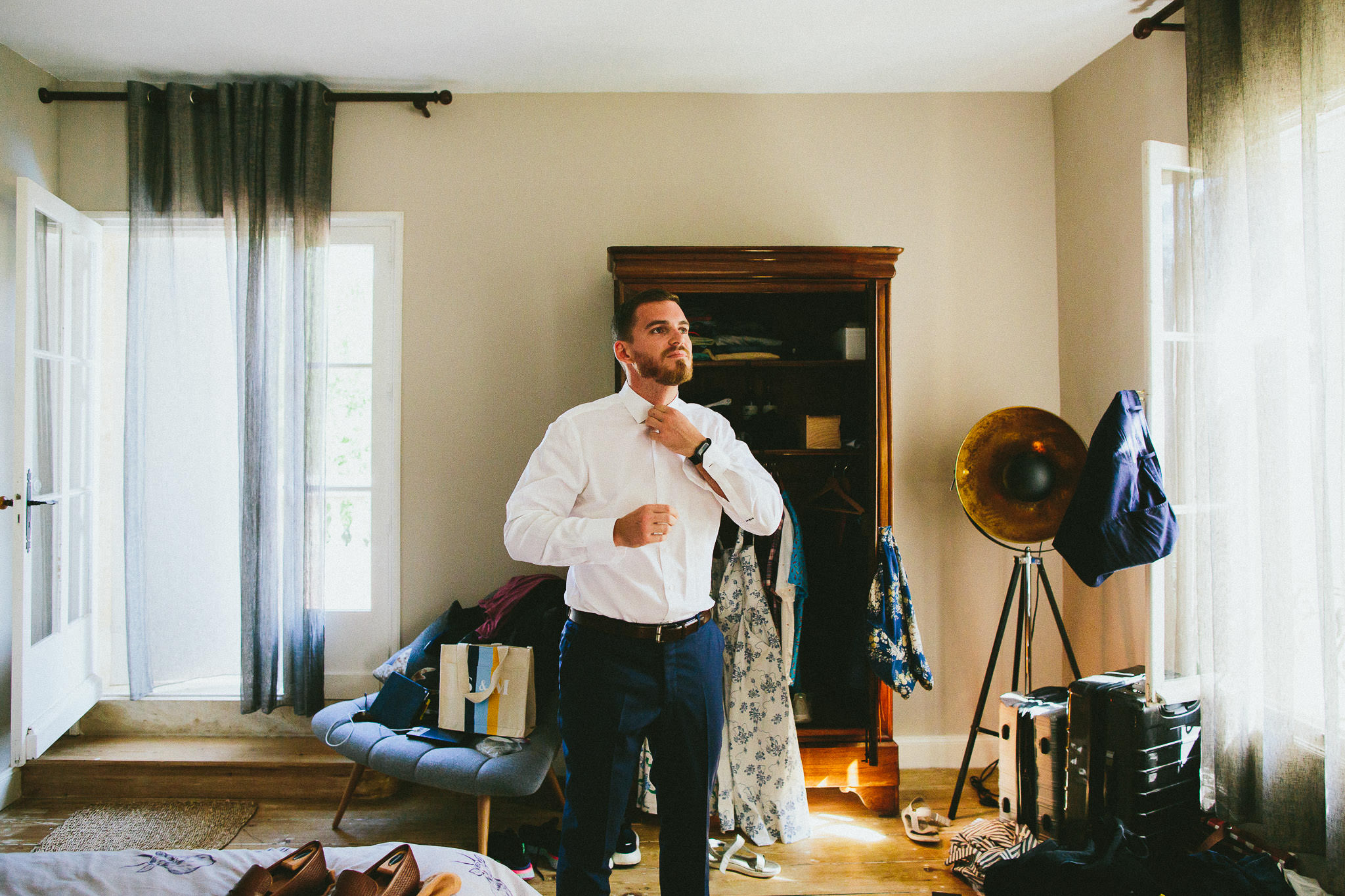 American destination wedding in France groom getting ready